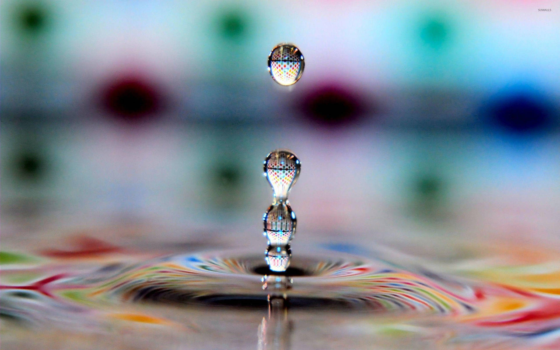 Multiple Droplets On Rippling Water