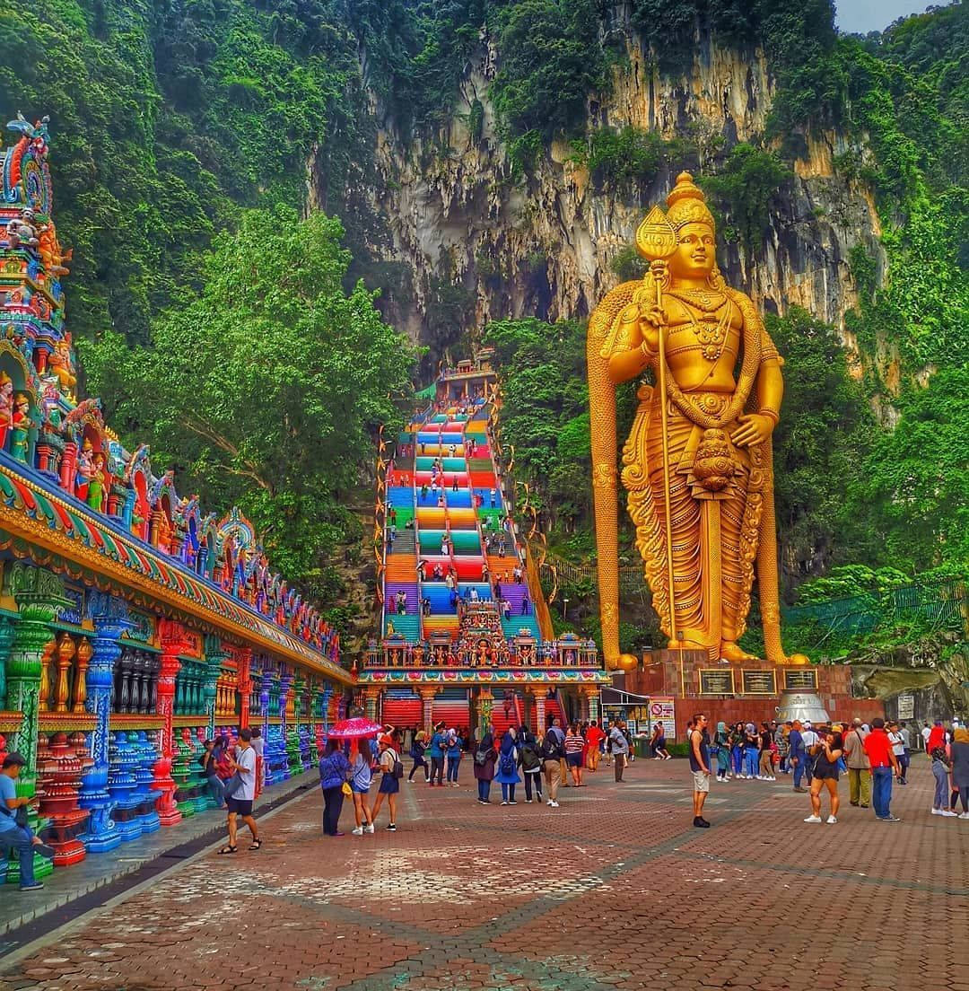 Murugan Statue Surrounded By People Background