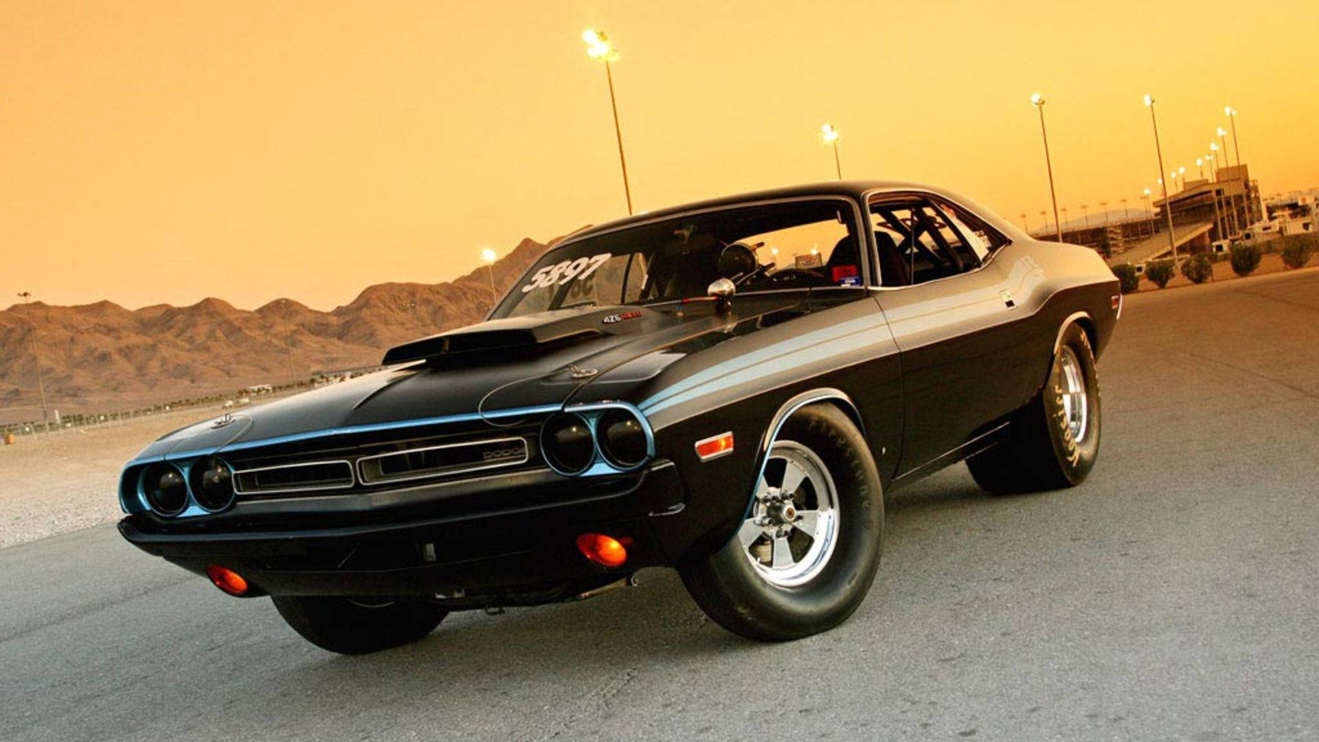 Muscle Car Near Streetlamps Background