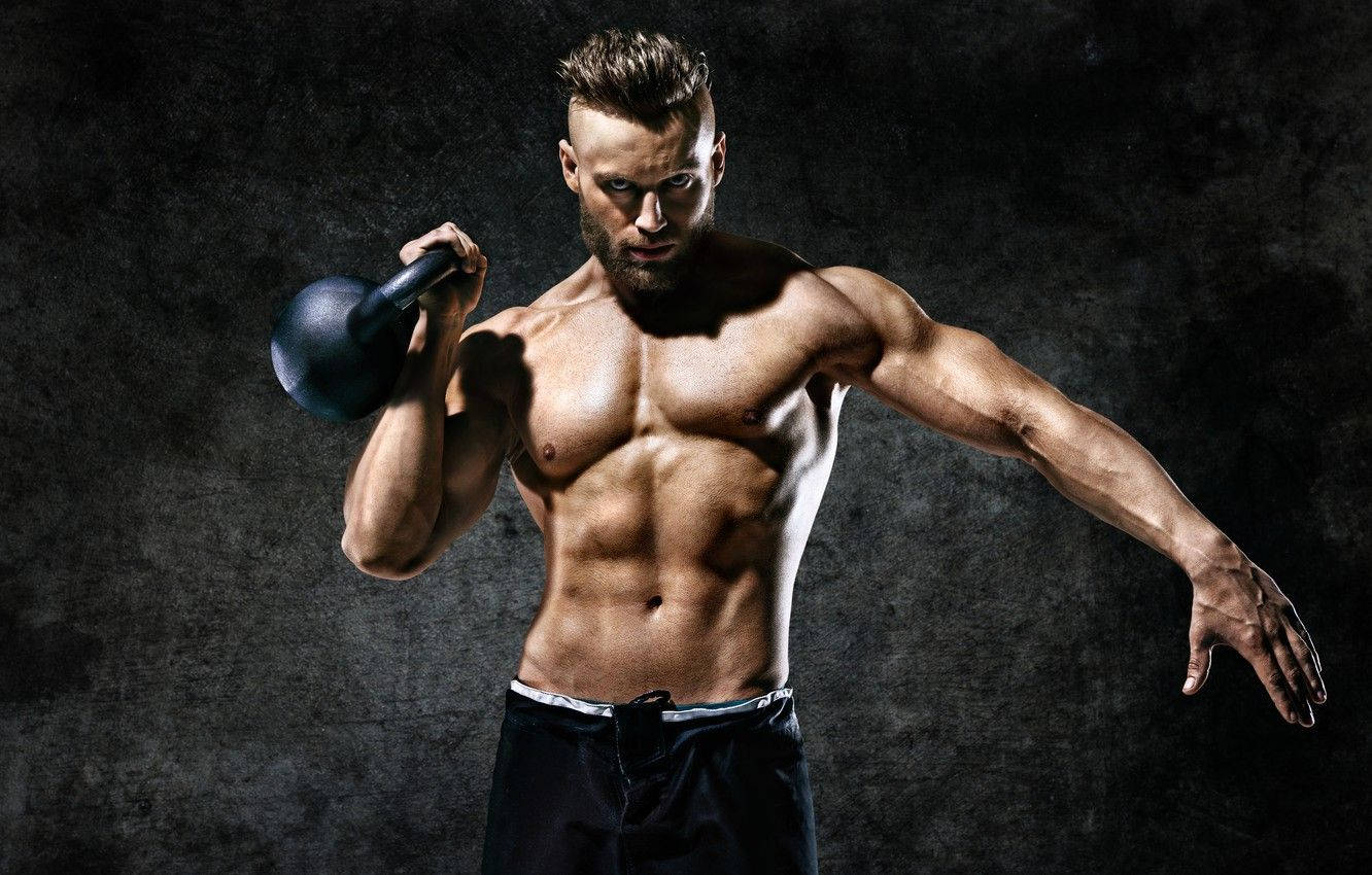 Muscle Man Lifting A Kettlebell Background