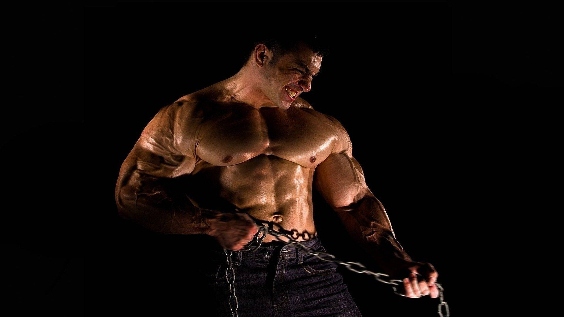 Muscle Man Pulling Heavy Chain Background