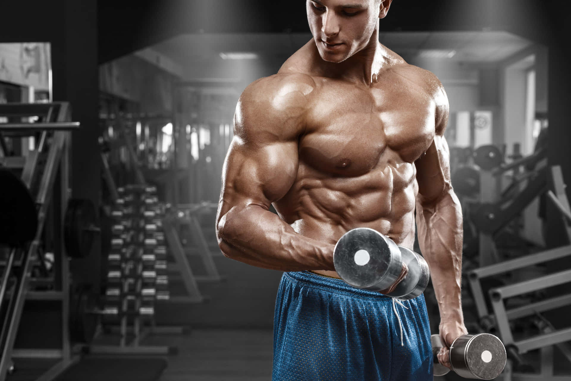 Muscular Man Dumbbell Curls Gym Workout.jpg