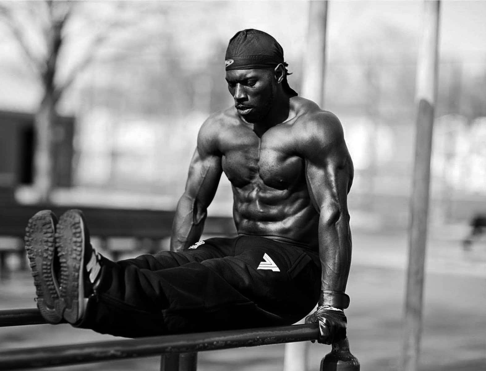 Muscular_ Man_ Outdoor_ Workout Background