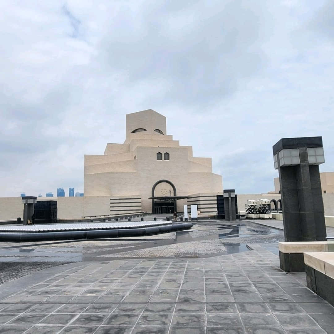 Museum Of Islamic Art Beneath Cloudy White Sky Background