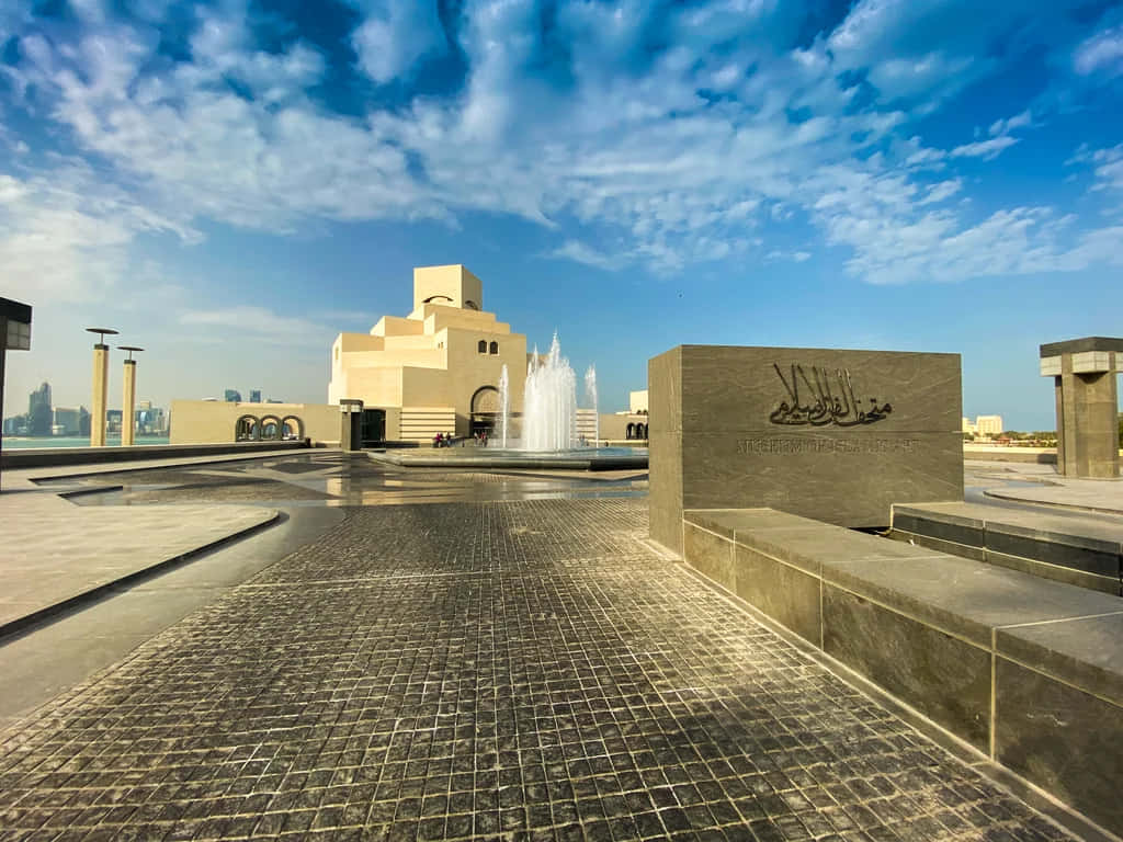 Museum Of Islamic Art Beneath The Blue Sky Background