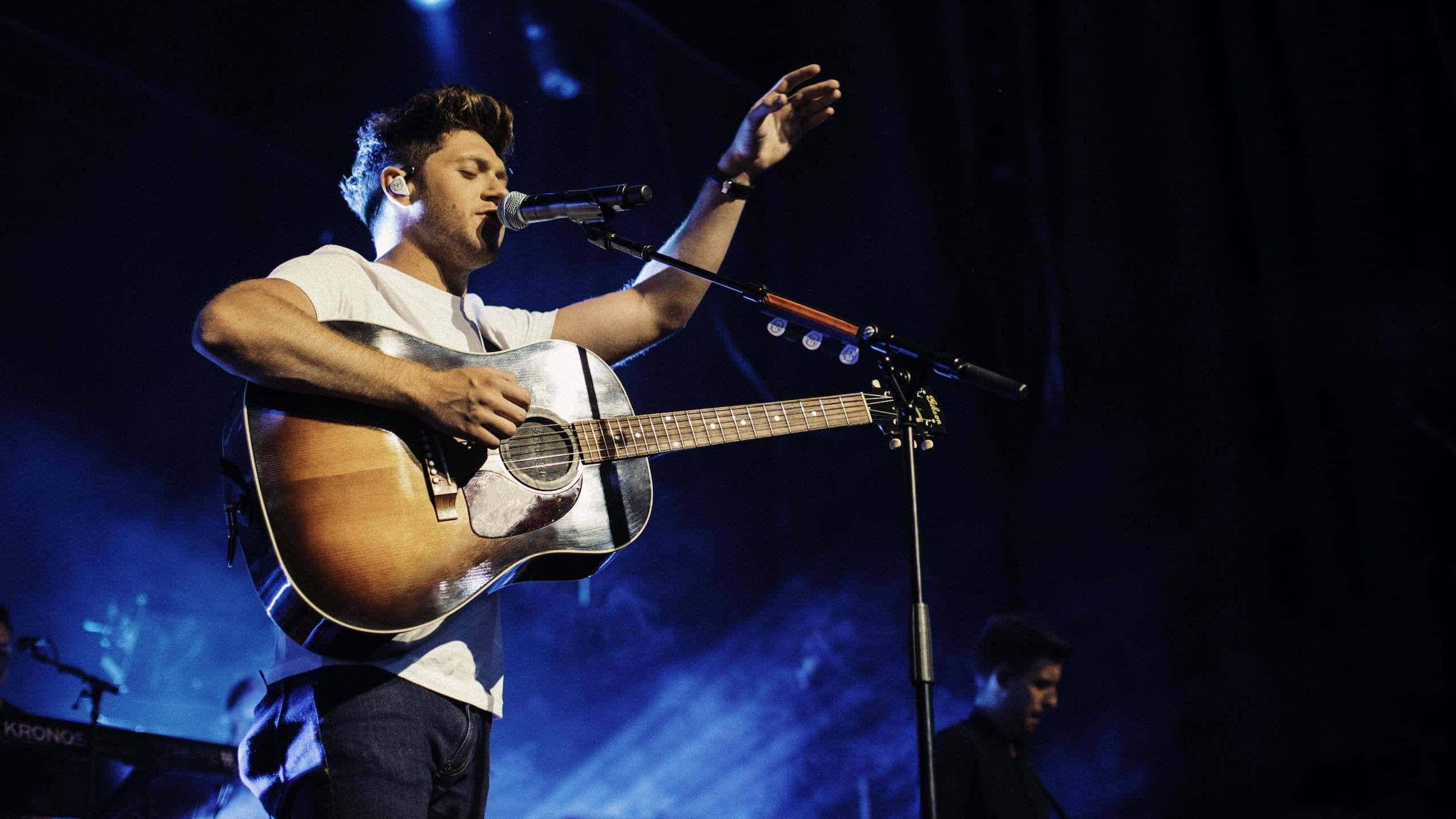 Music Legend Niall Horan Engaging With His Guitar