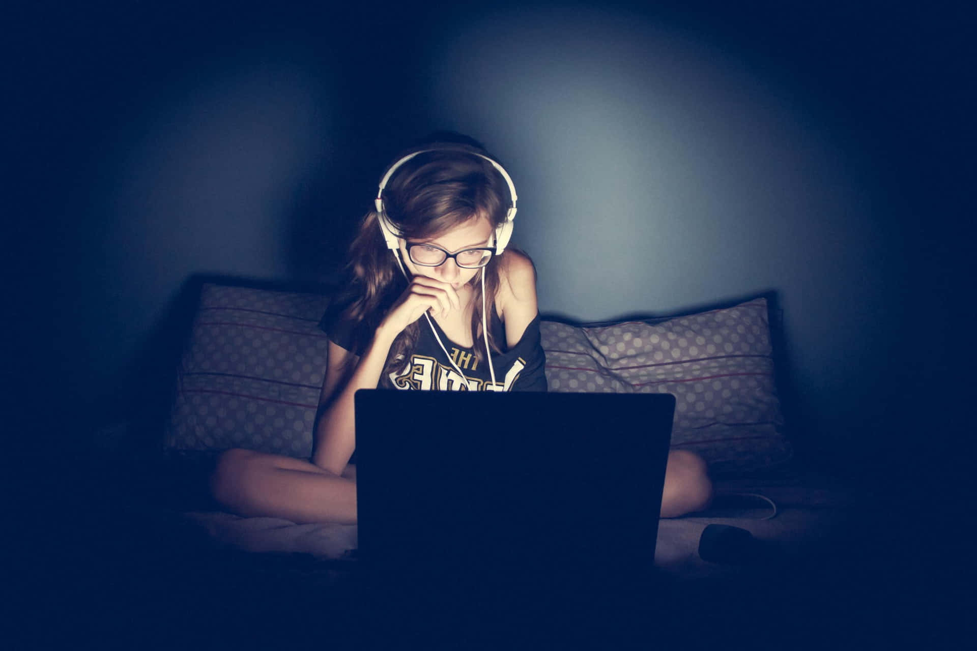 Music Producer Making Beats With A Laptop And Headphones Background