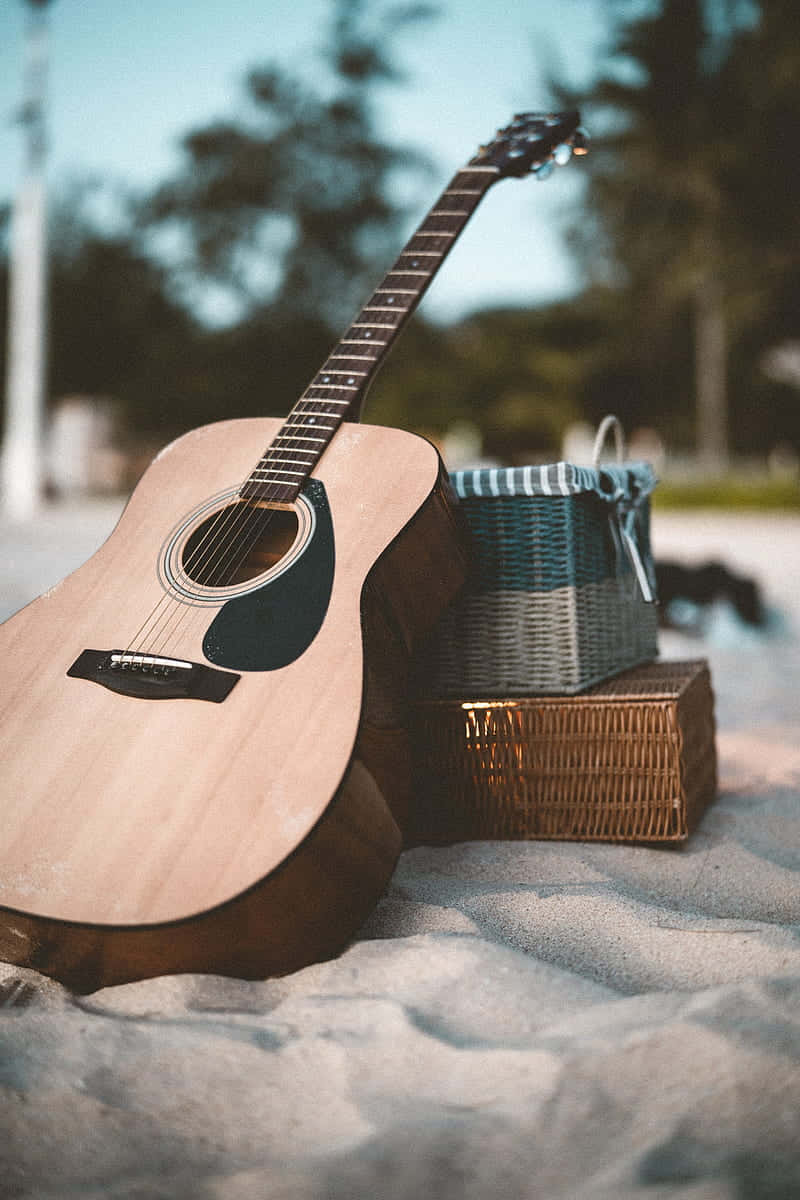 Musical Instrument Guitar On Beach