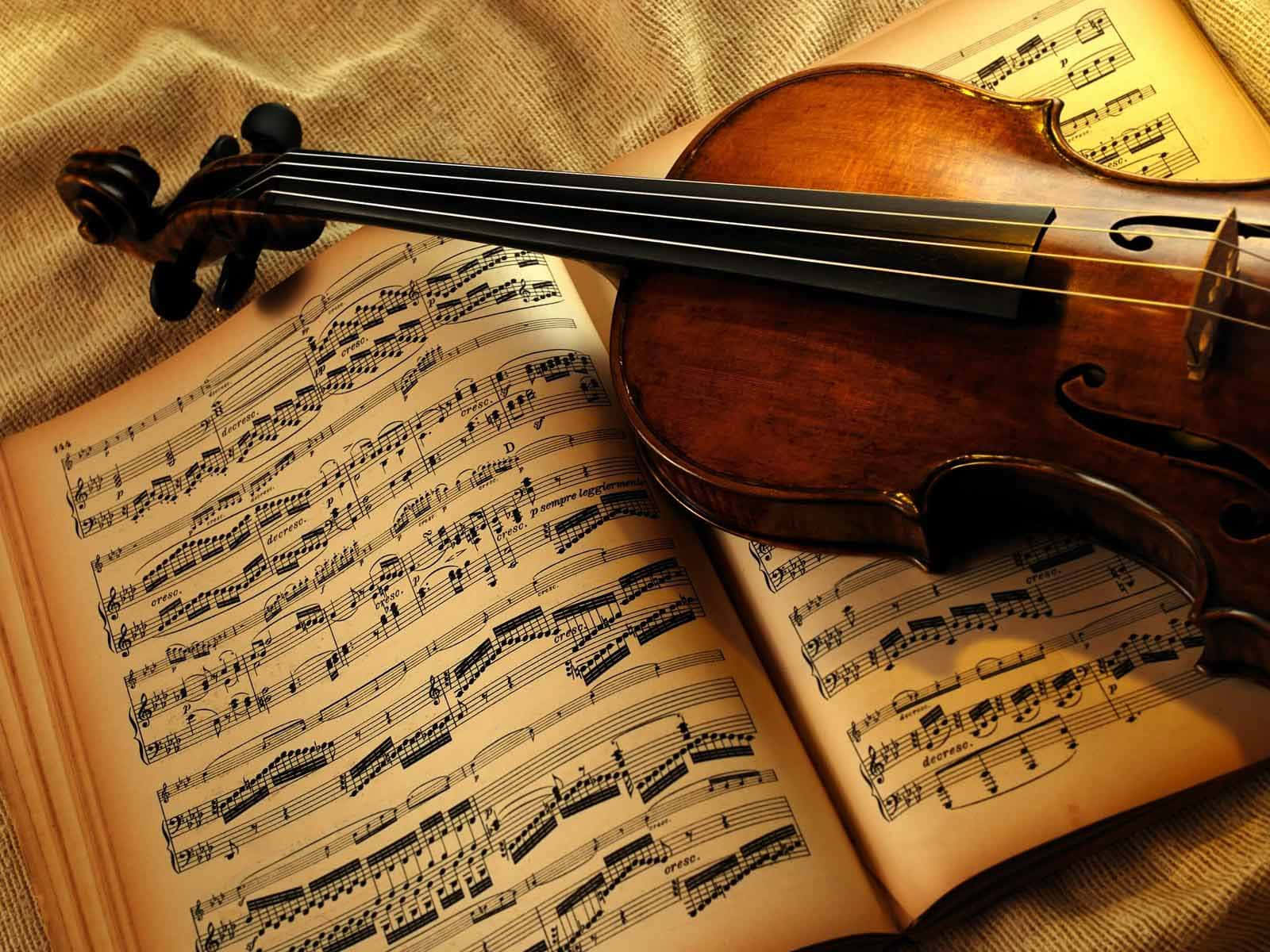 Musical Instrument Violin On Music Sheet