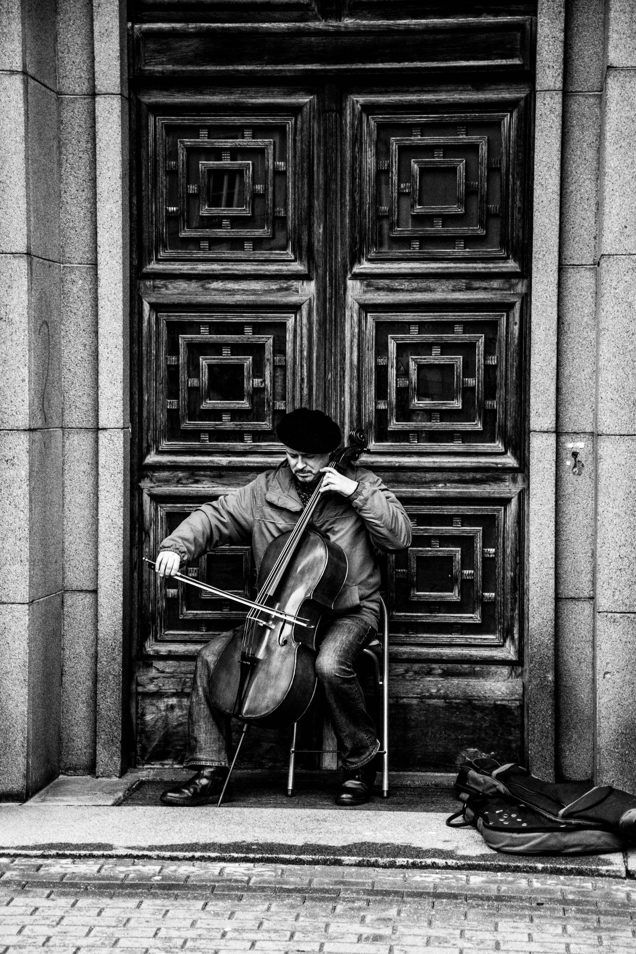 Musician In The Street Of Riga Background