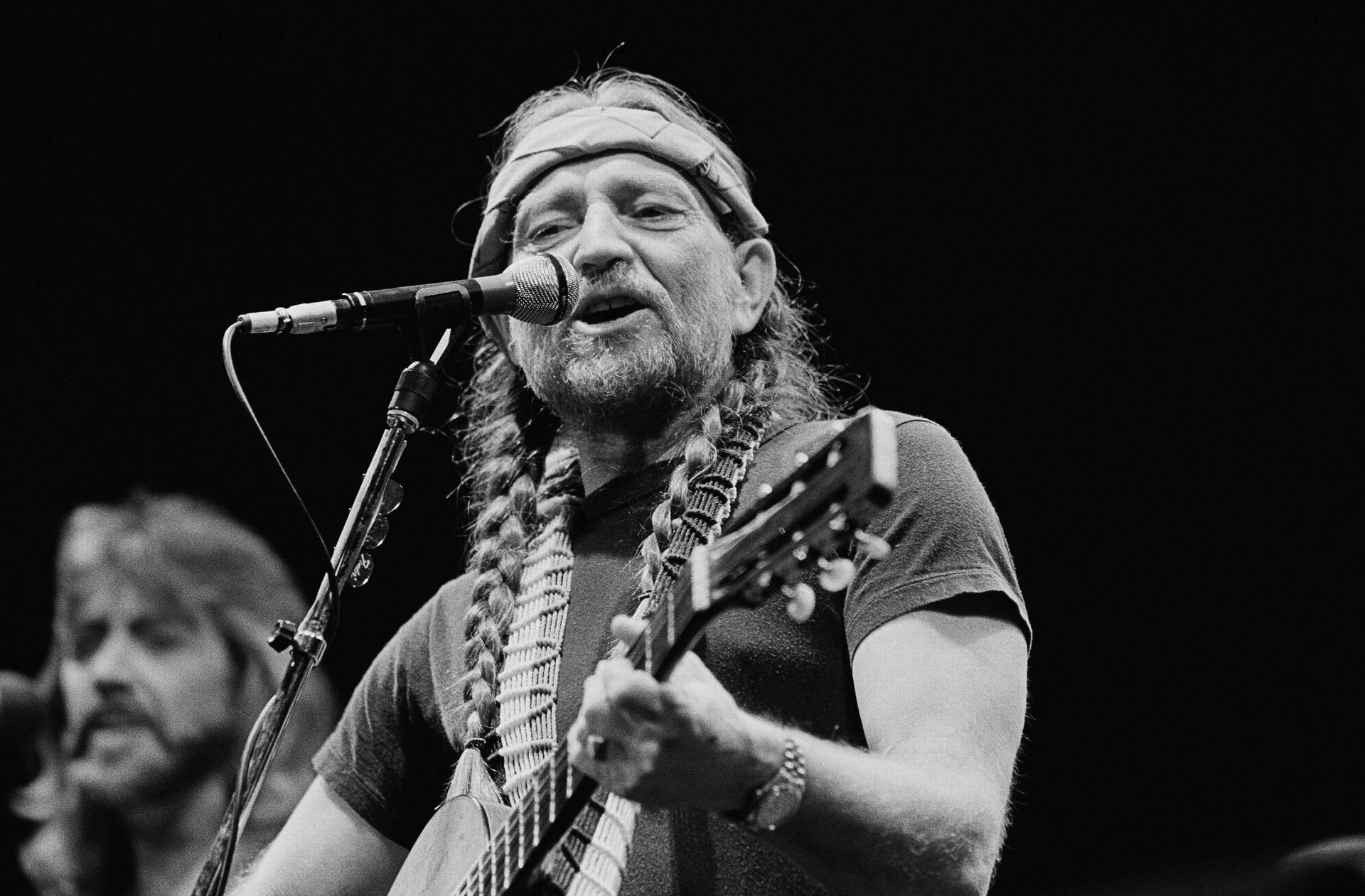 Musician Willie Nelson Performing On Stage