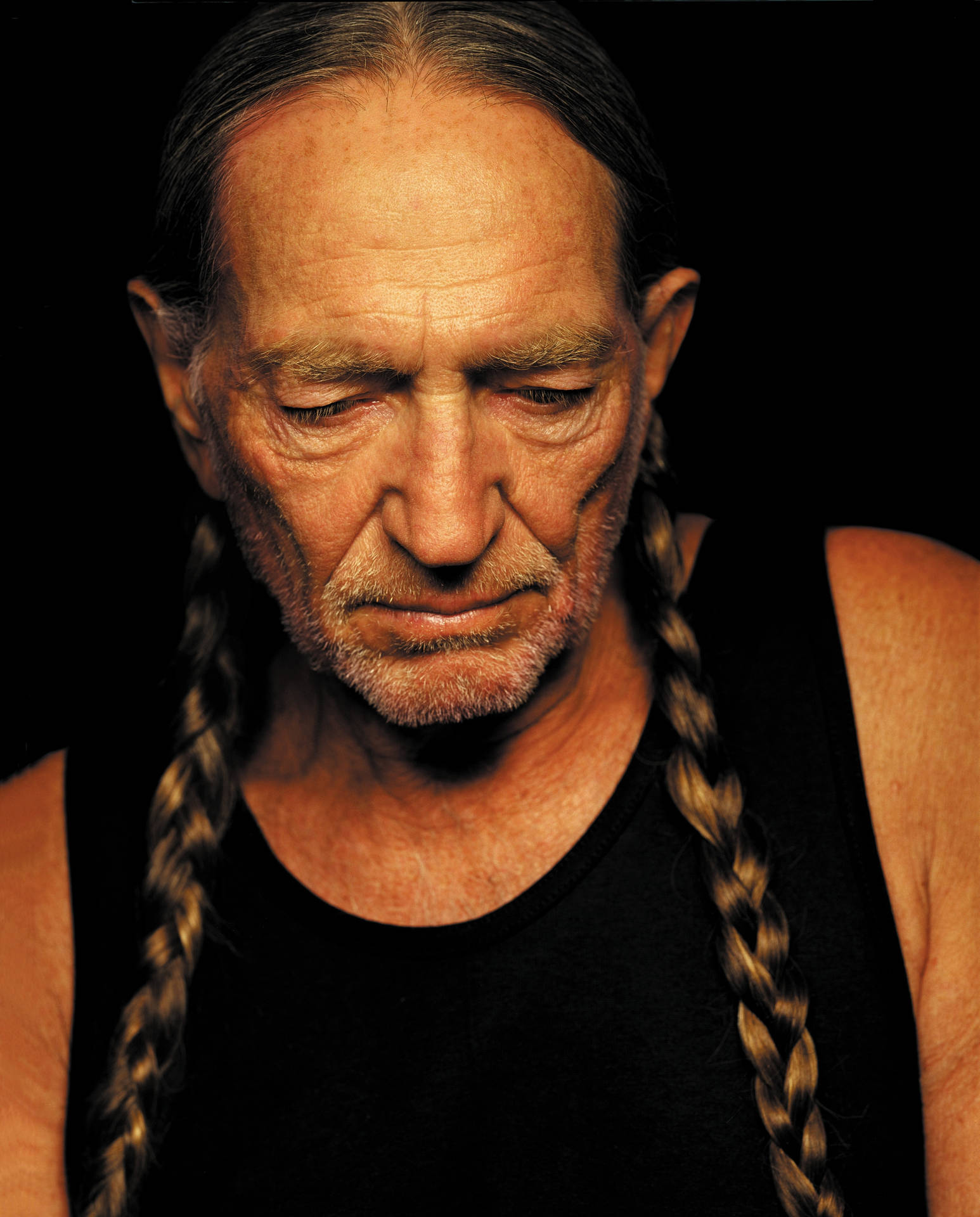 Musician Willie Nelson With Braided Hair Background