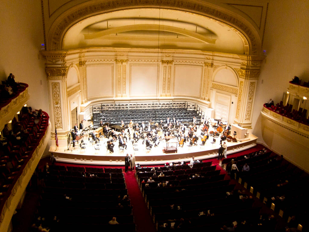 Musicians On Carnegie Hall Stage Background