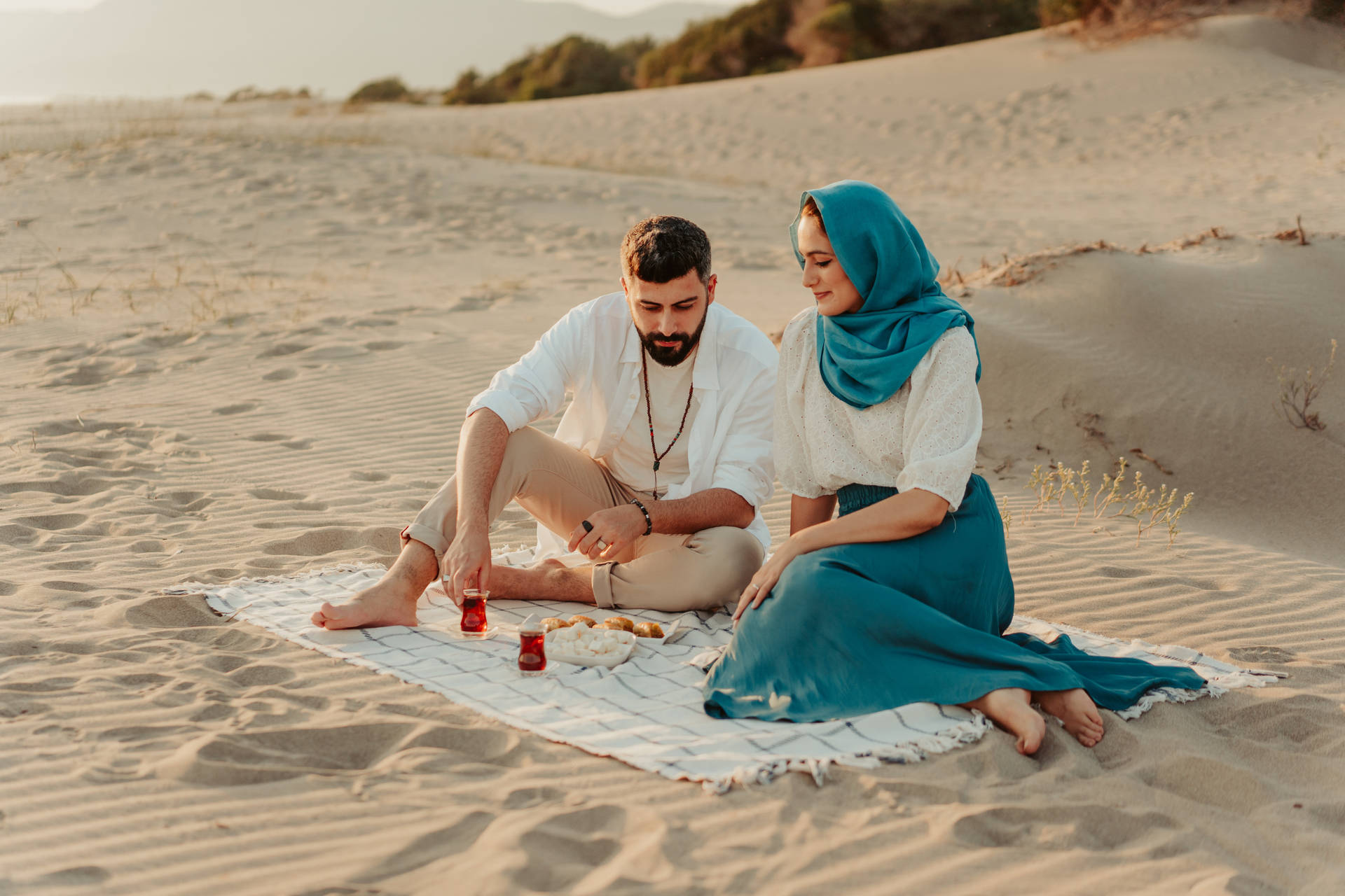 Muslim Couple At The Beach Background