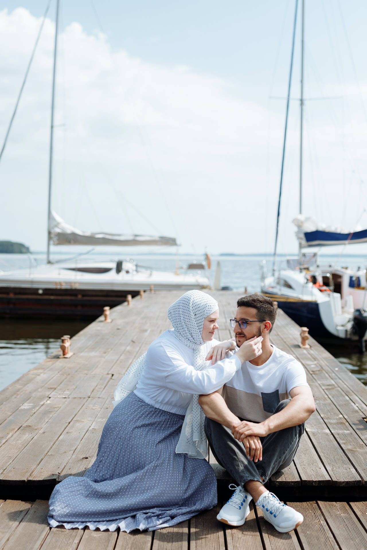 Muslim Couple On Wooden Dock