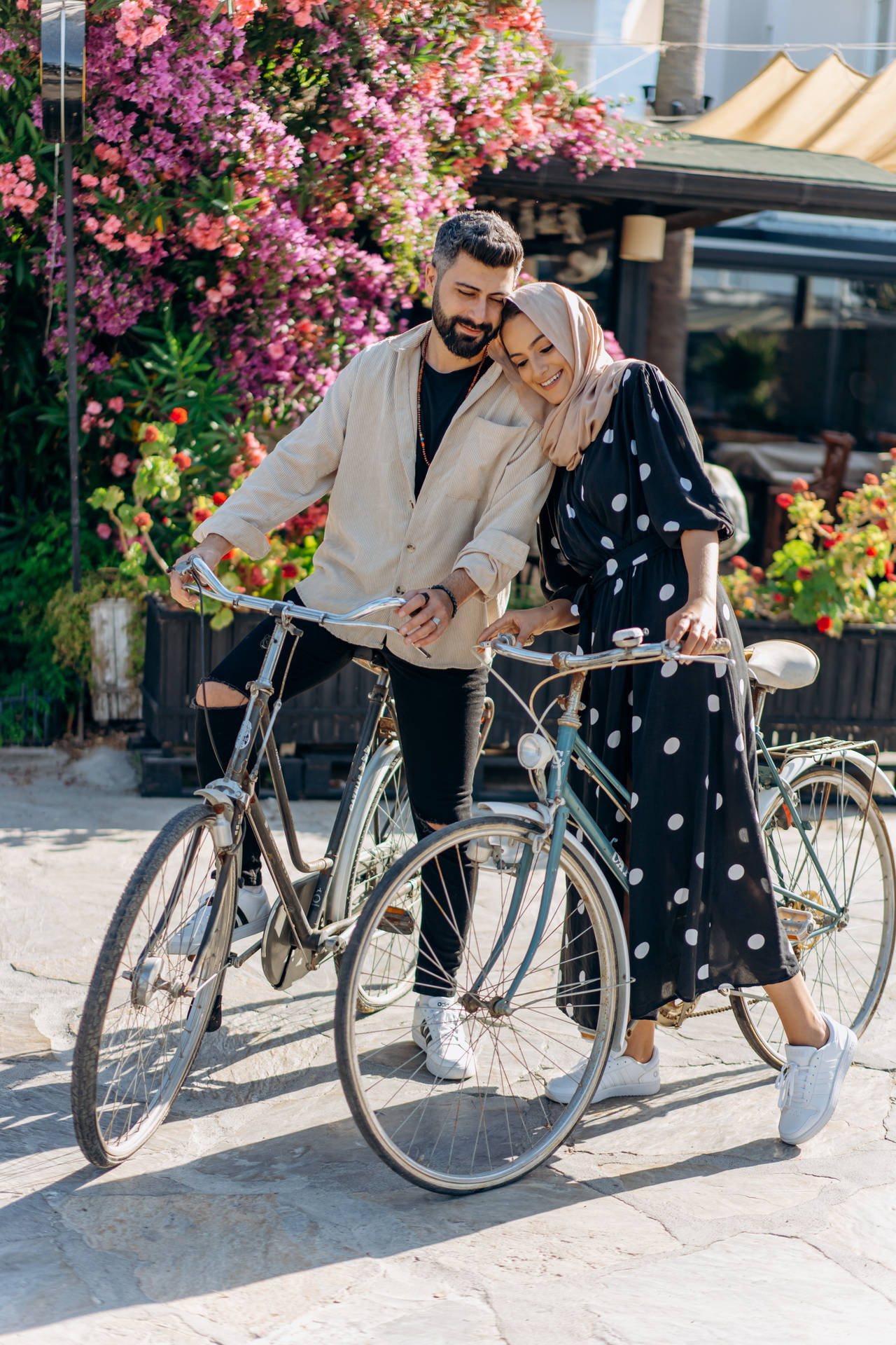Muslim Couple With Bicycles Background