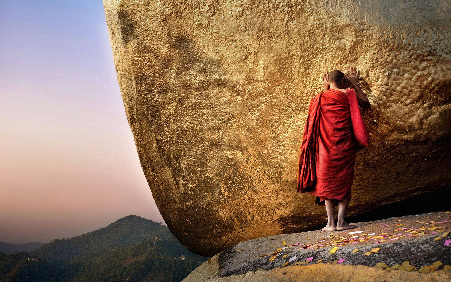 Myanmar Monk With Big Rock Background