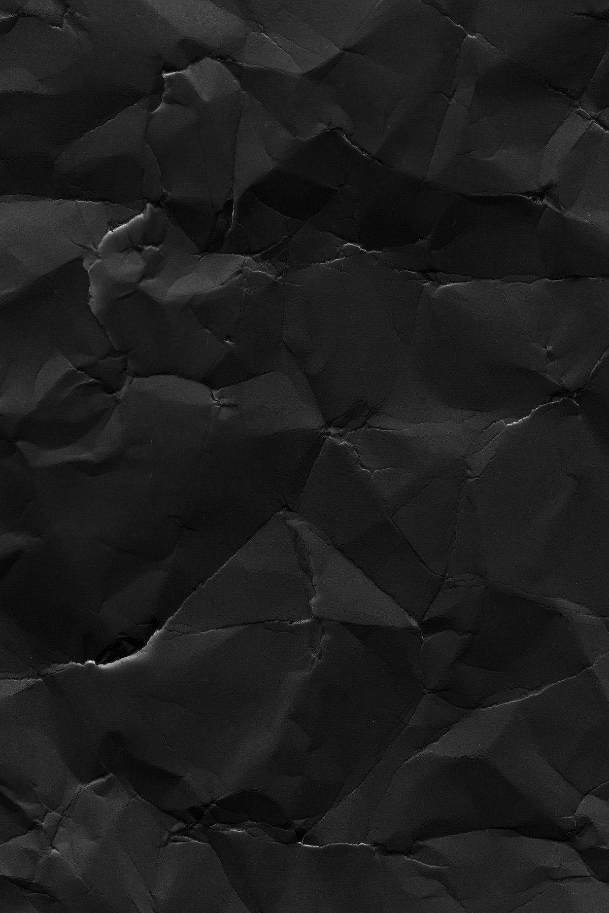 Mysterious Black Crumpled Paper Background