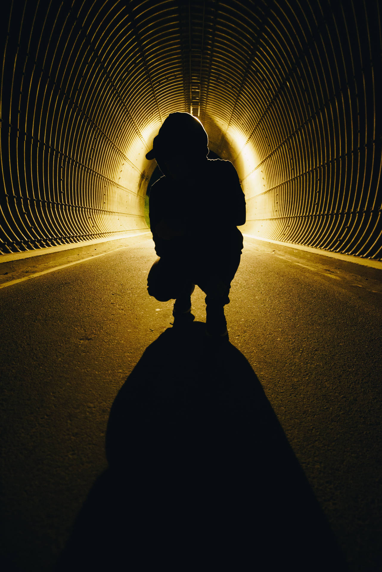 Mysterious Boy Shadow In Dark Tunnel Background
