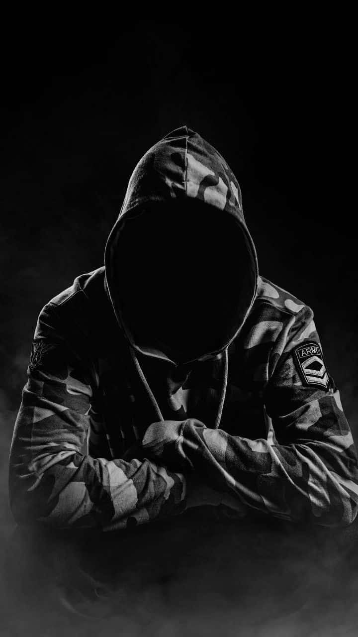 Mysterious_ Figure_in_ Camouflage_ Hoodie.jpg Background