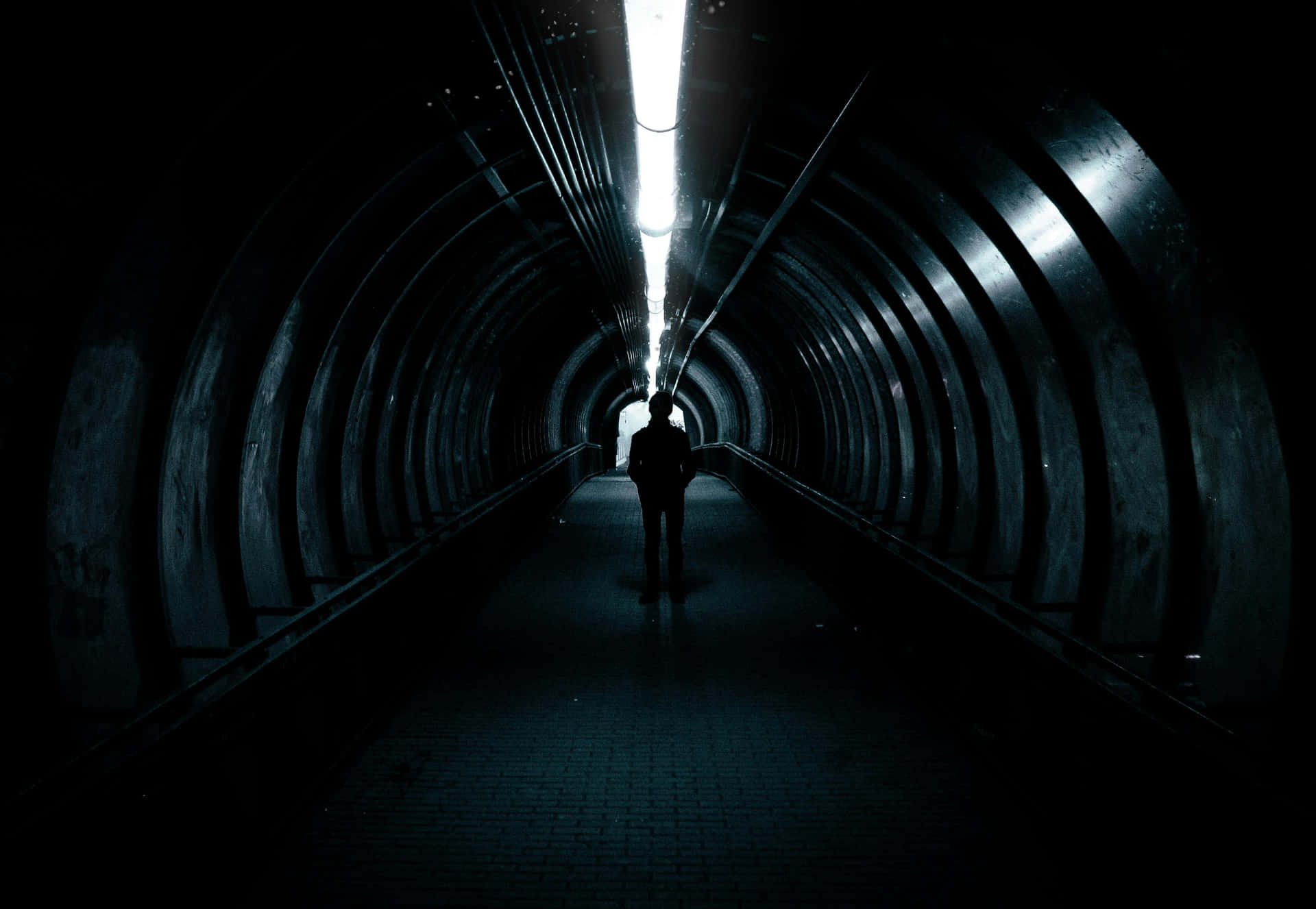 Mysterious Figurein Dark Tunnel.jpg Background