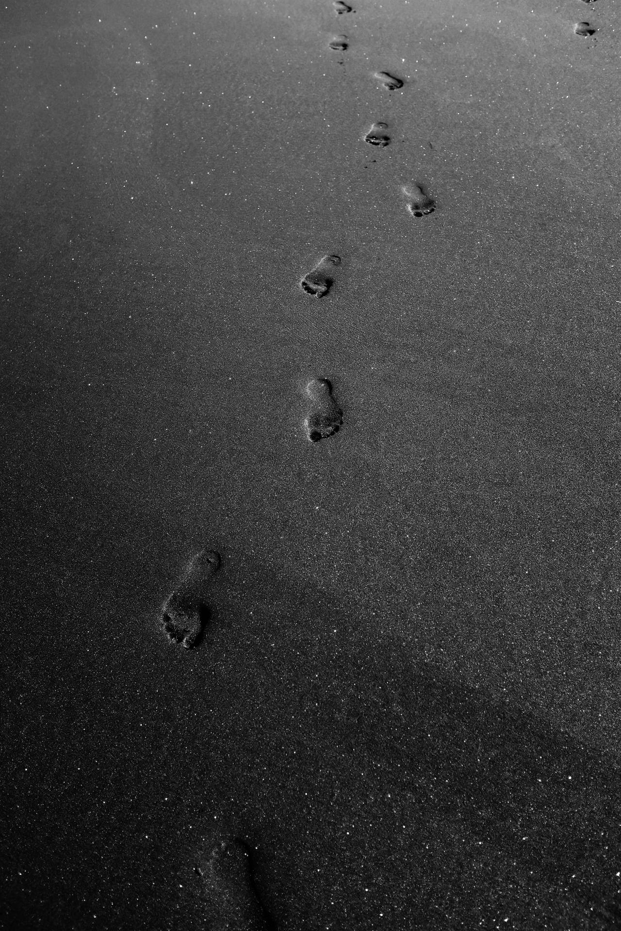 Mysterious Footprints On A Black Background