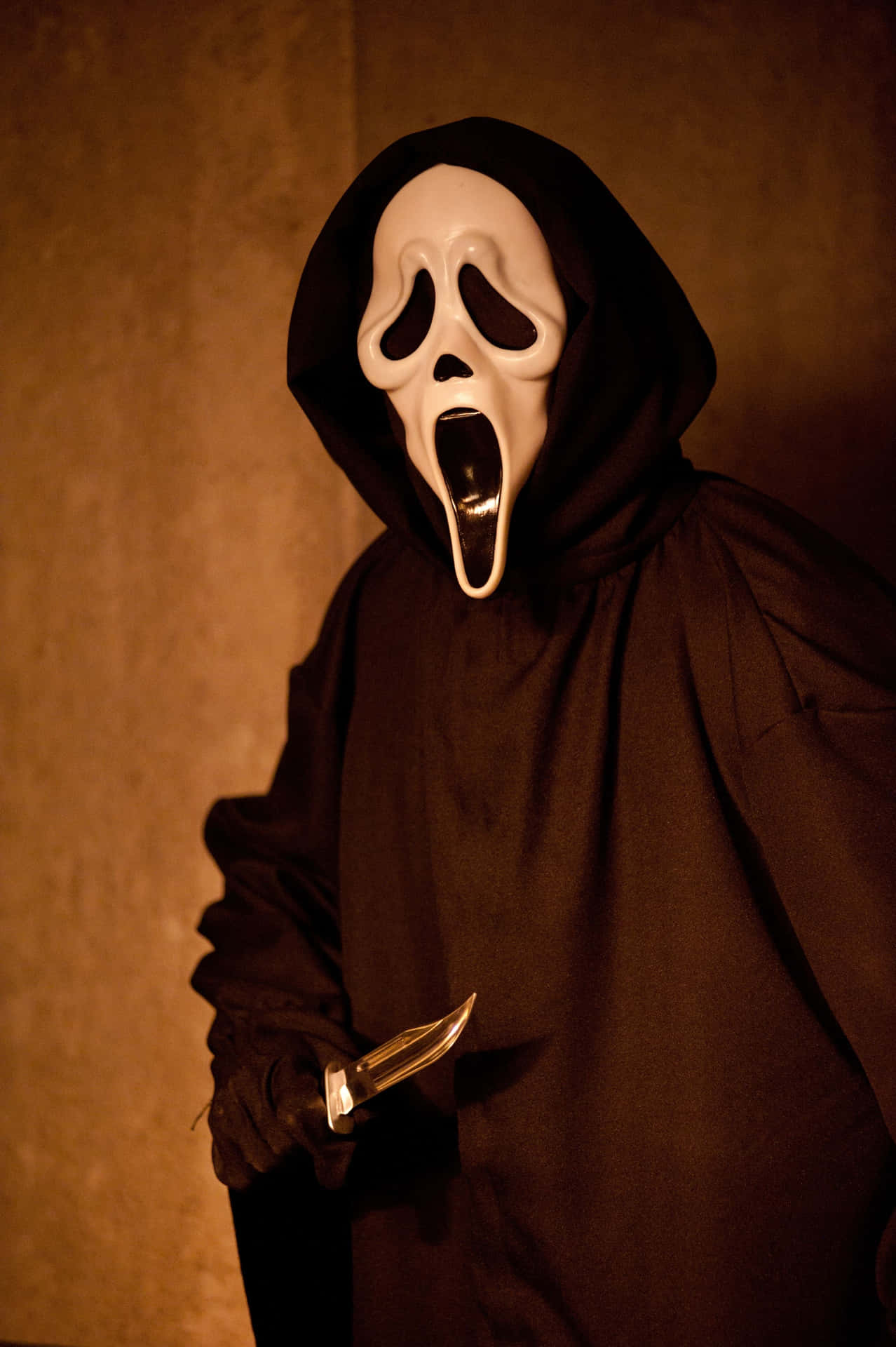 Mysterious Ghostface In Shadows Background