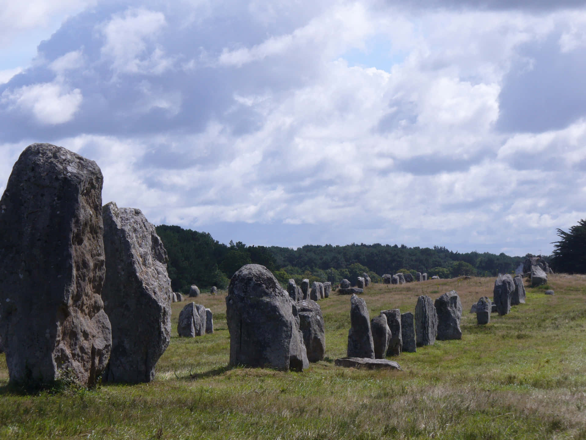 Mysterious Granite Stones Alignment In Scenic Carnac Background