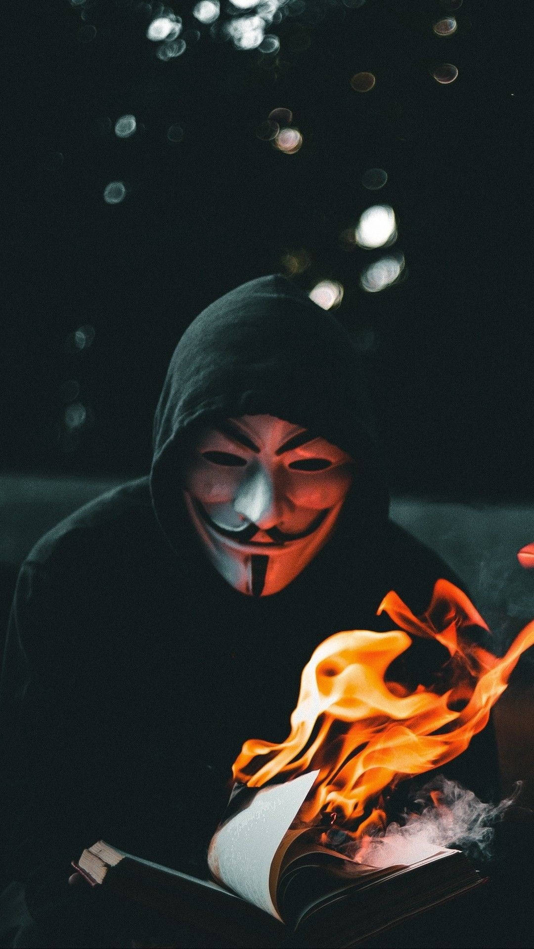 Mysterious Hacker In Shadowy Flames Background