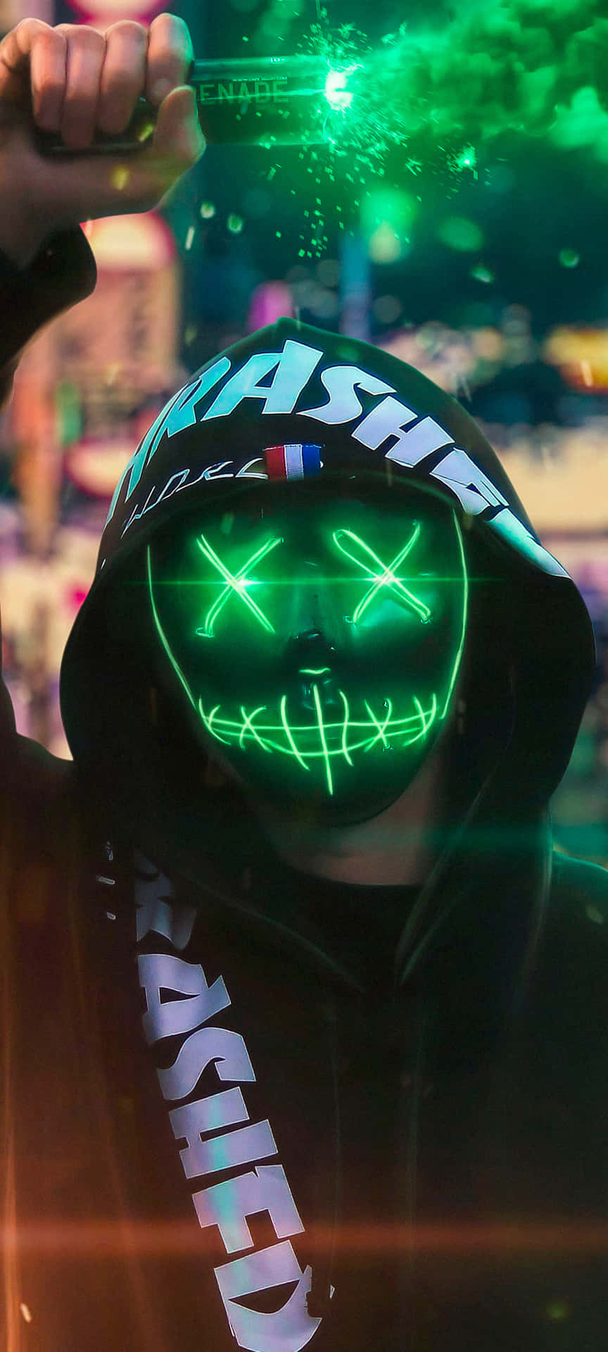 Mysterious Neon Mask Guy Enveloped In Green Smoke Background