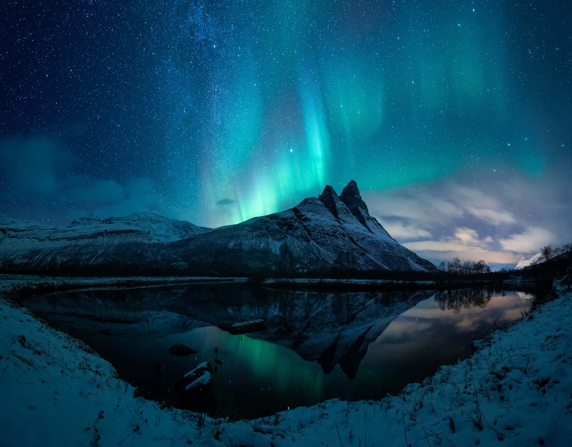 Mystical Aurora Borealis Paints A Breathtaking Scene Across The Night Sky