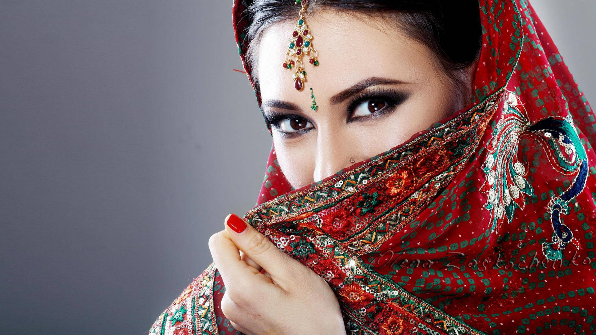 Mystical Gaze - Indian Girl Wrapped In Red Background