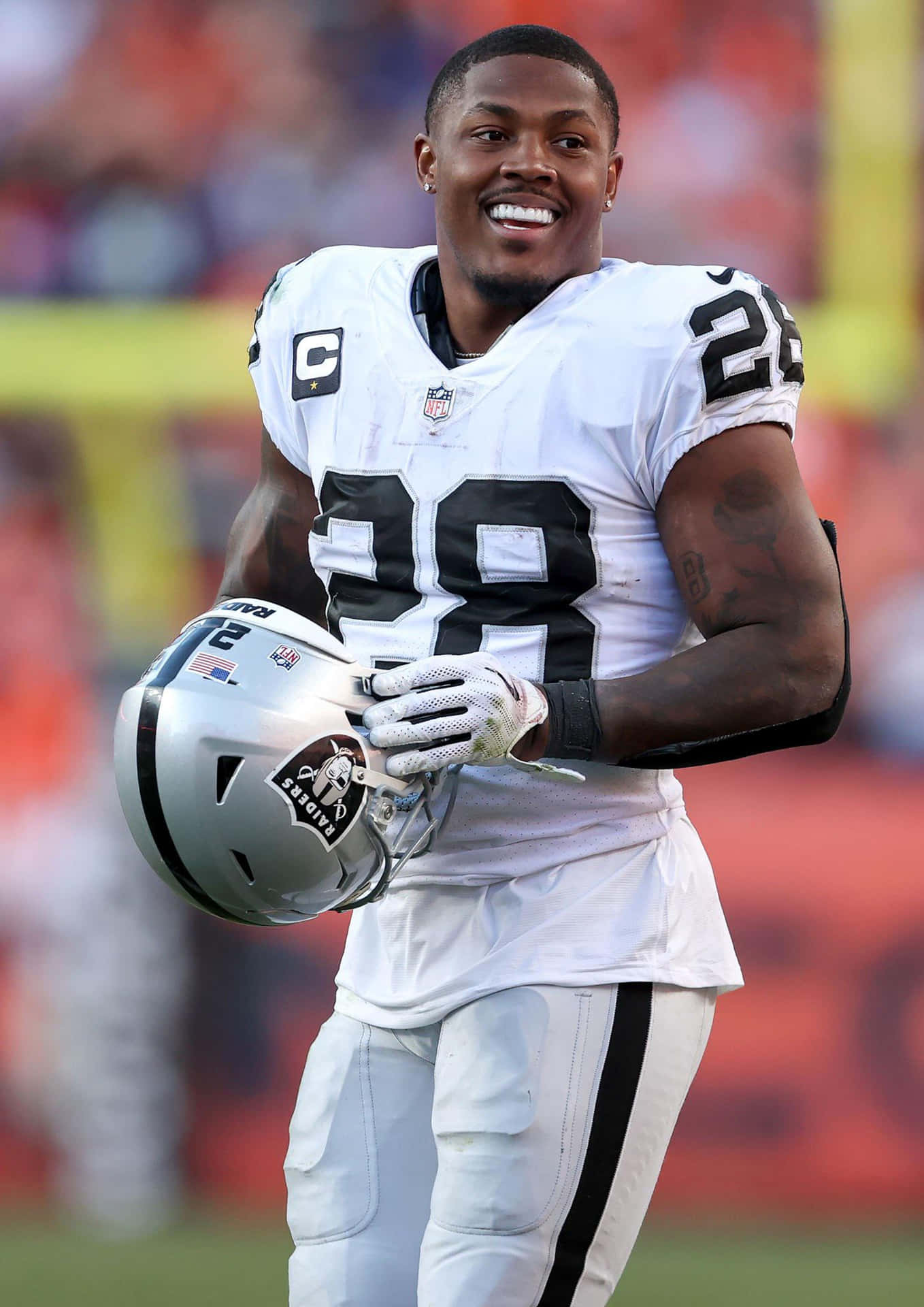 N F L Playerwith Helmetand Captain Patch