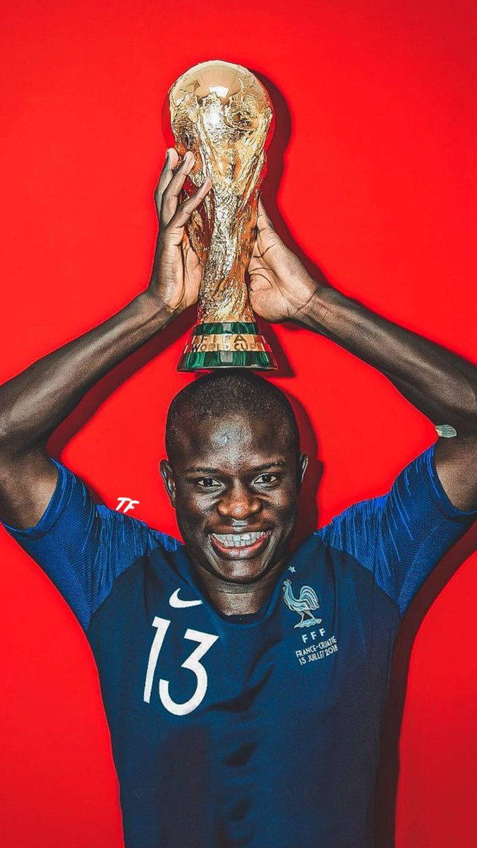 N'golo Kante Holding A Trophy