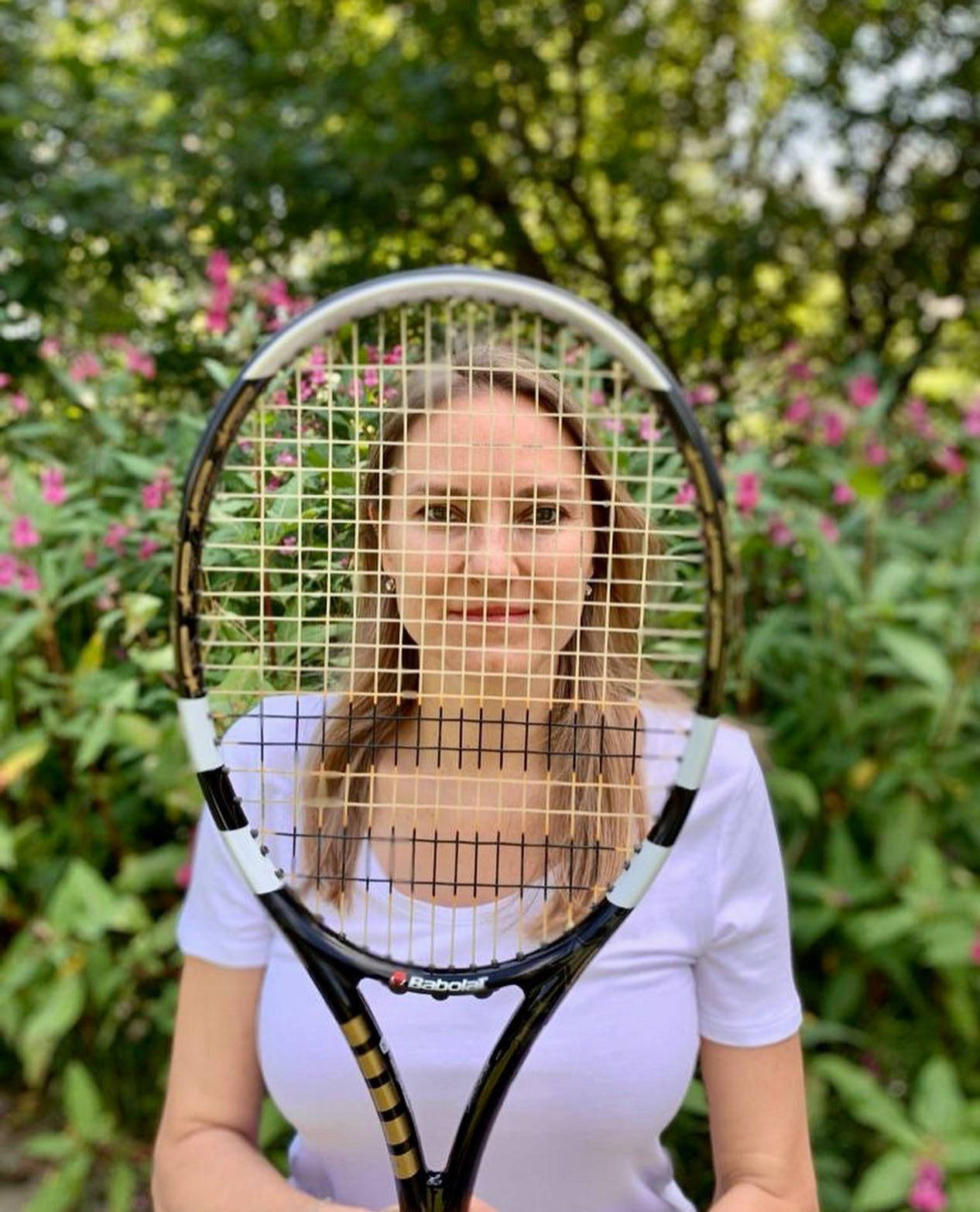 Nadia Petrova Face Covered By Racket Background