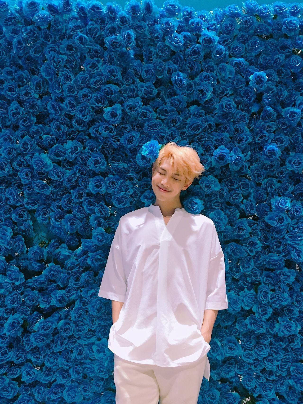 Namjoon Poses With Blue Roses Background