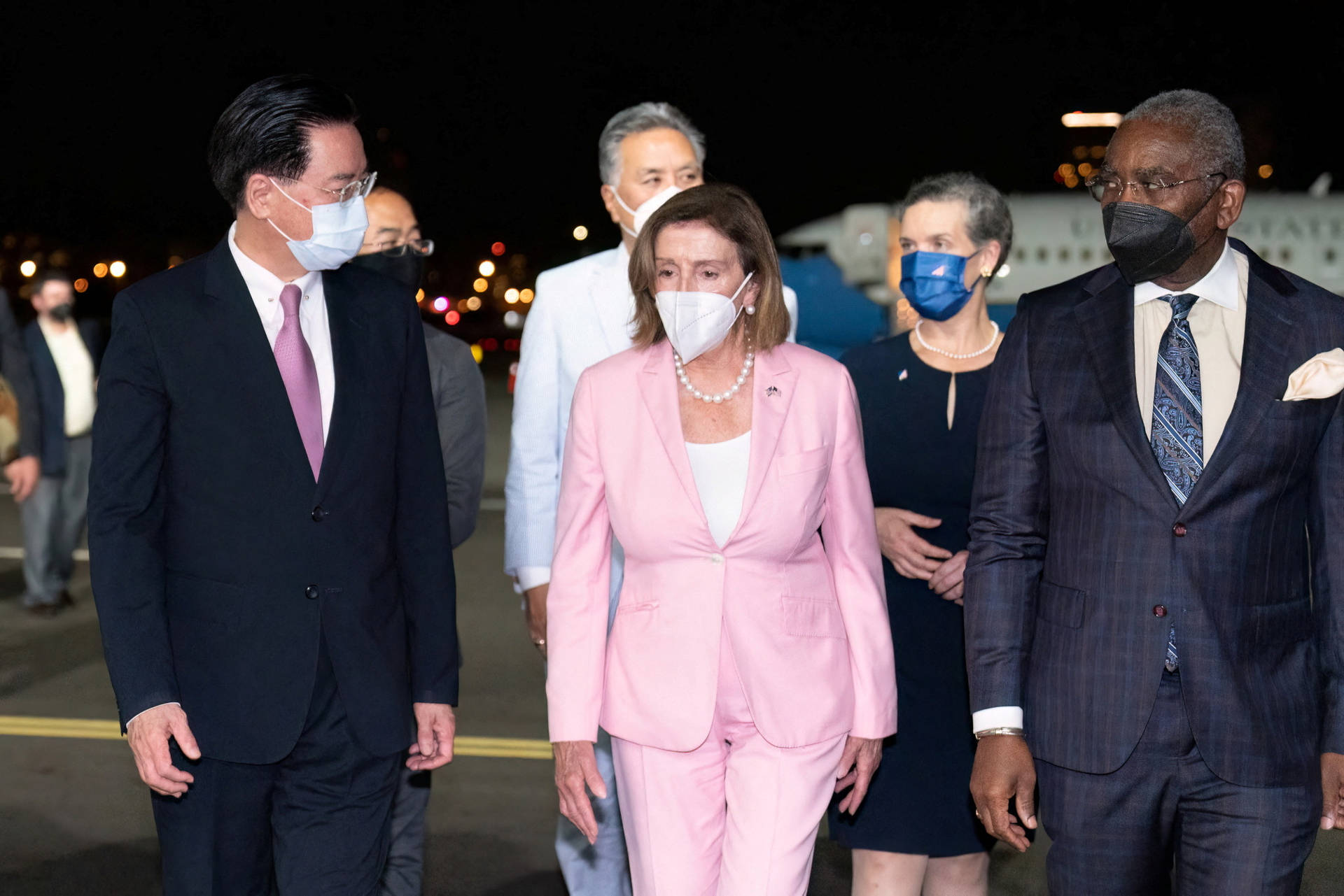 Nancy Pelosi In A Pink Pantsuit Background