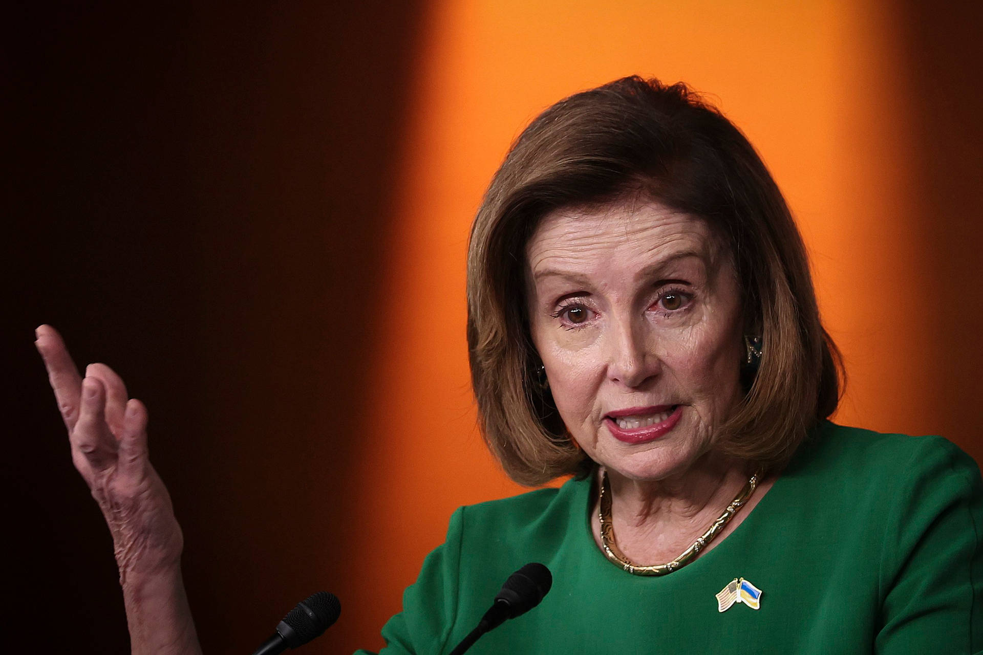 Nancy Pelosi In Green Clothing Background