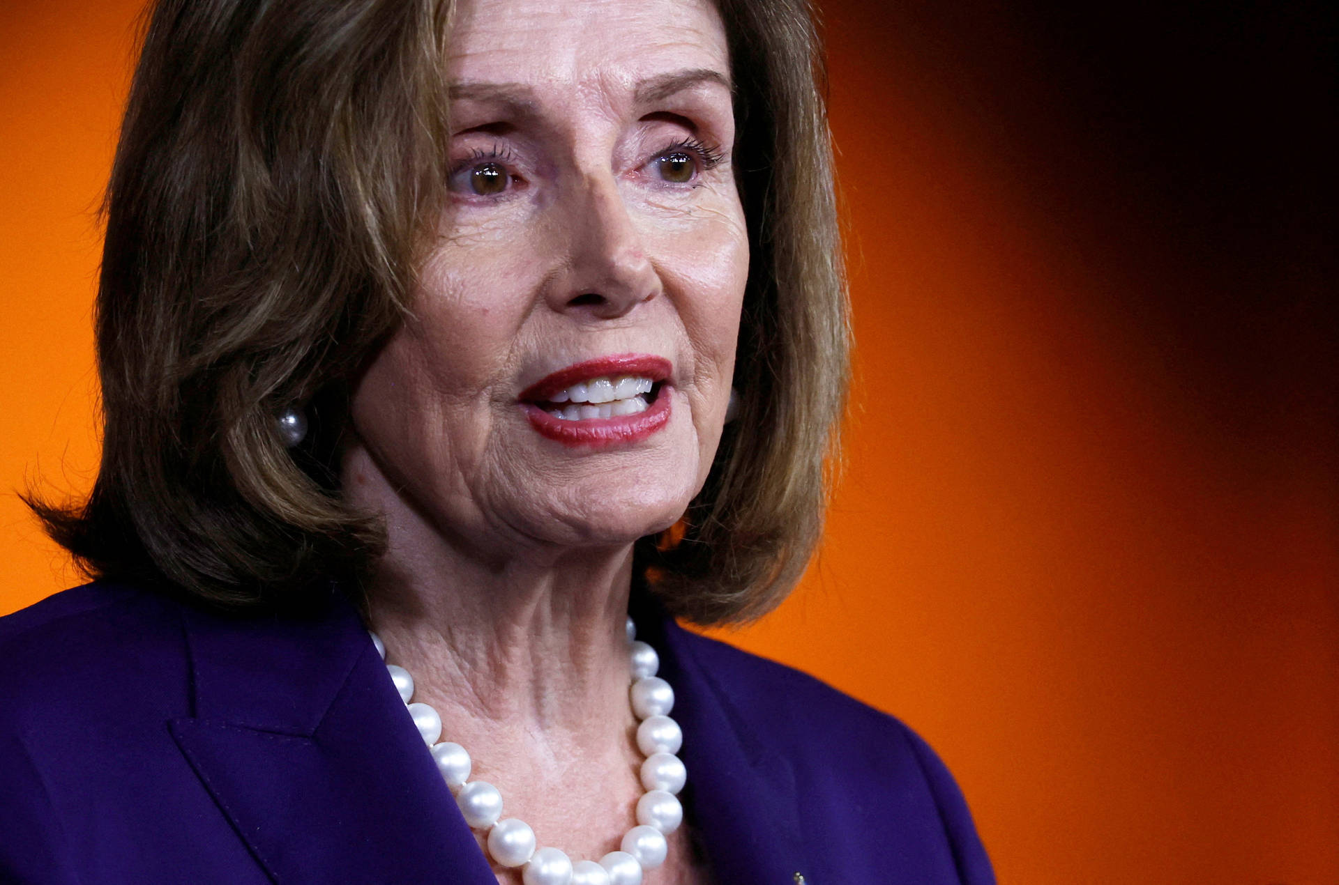 Nancy Pelosi Orange Black Background Background