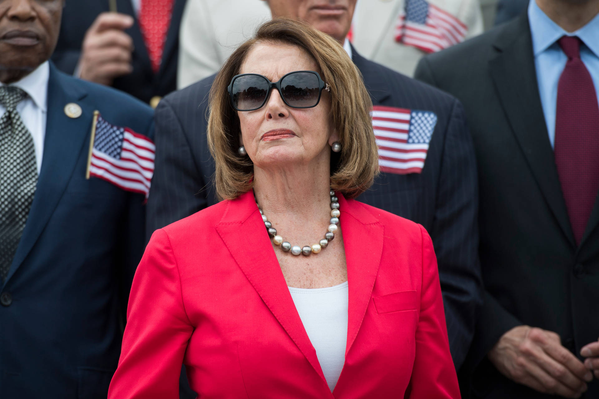 Nancy Pelosi Red Dress Sunglasses Background