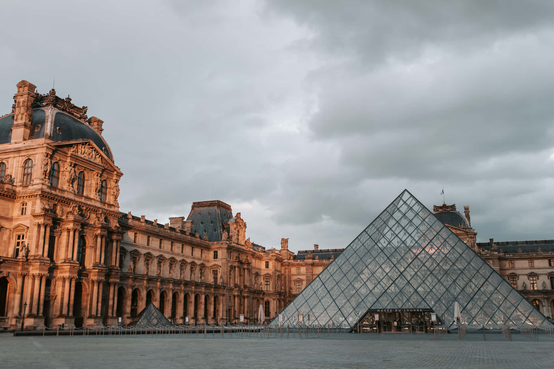 Napolean Courtyard In The Louvre Museum Background