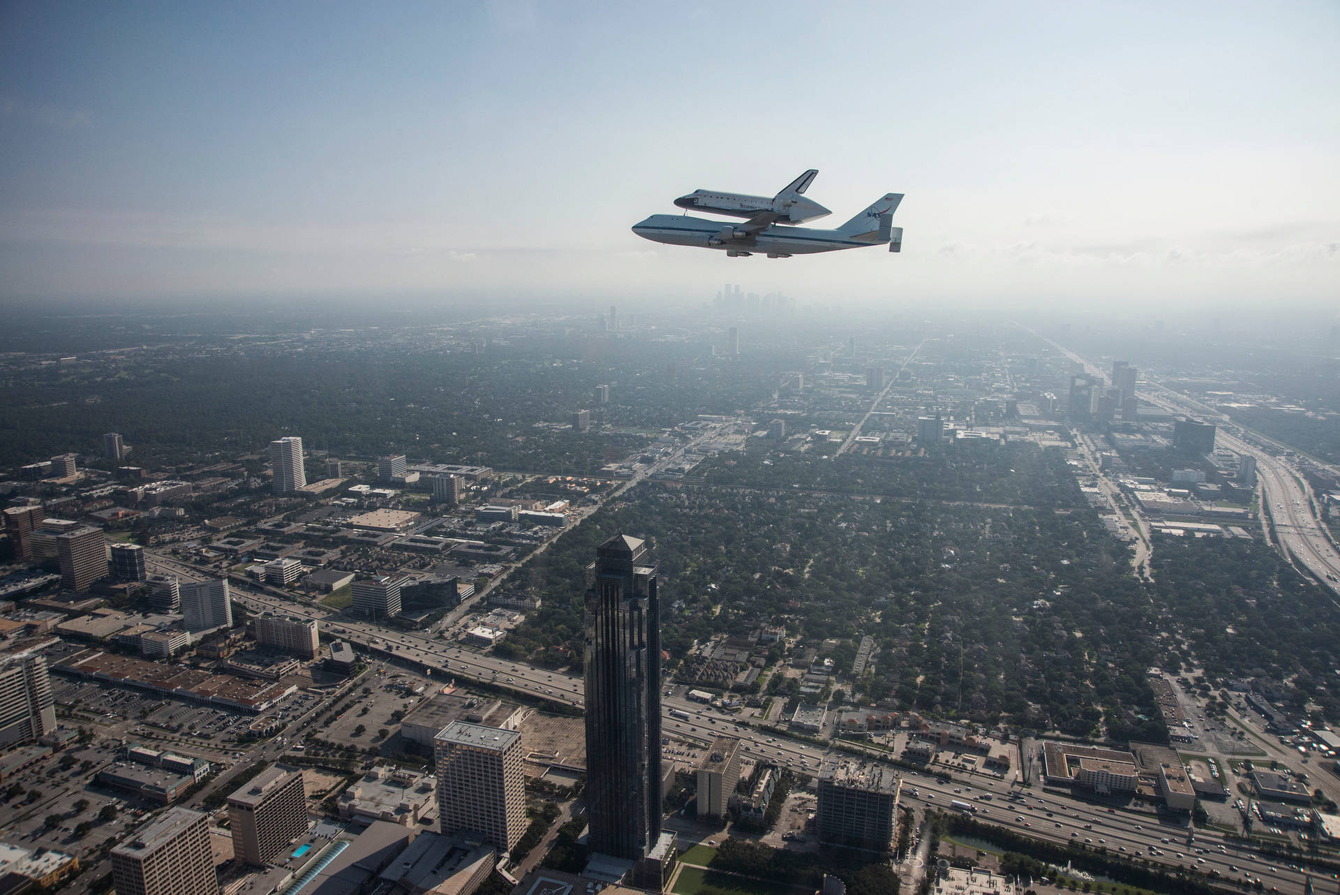 Nasa Houston Aircrafts Flying In Sky Background