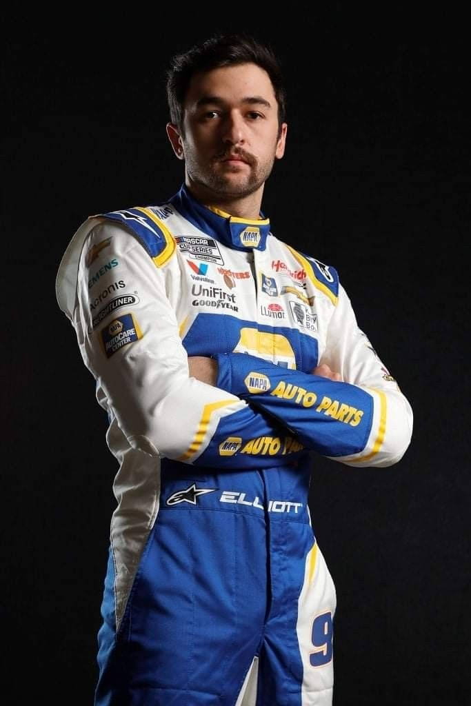 Nascar Driver Chase Elliott, Arms Crossed On A Black Background Background