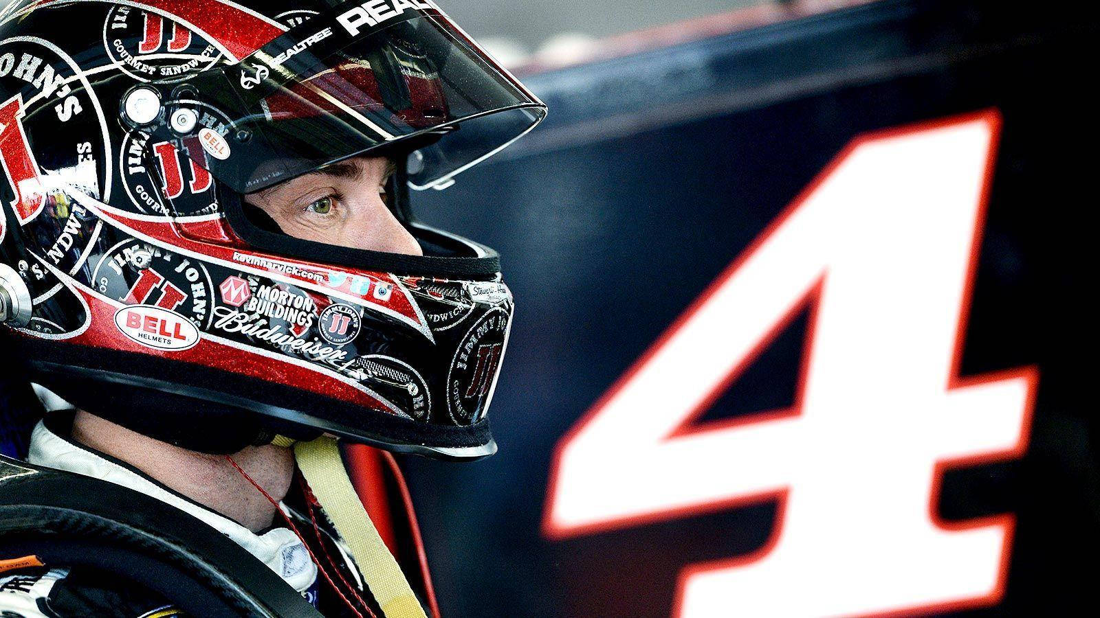 Nascar Driver Kevin Harvick Suited Up With His Helmet On Background