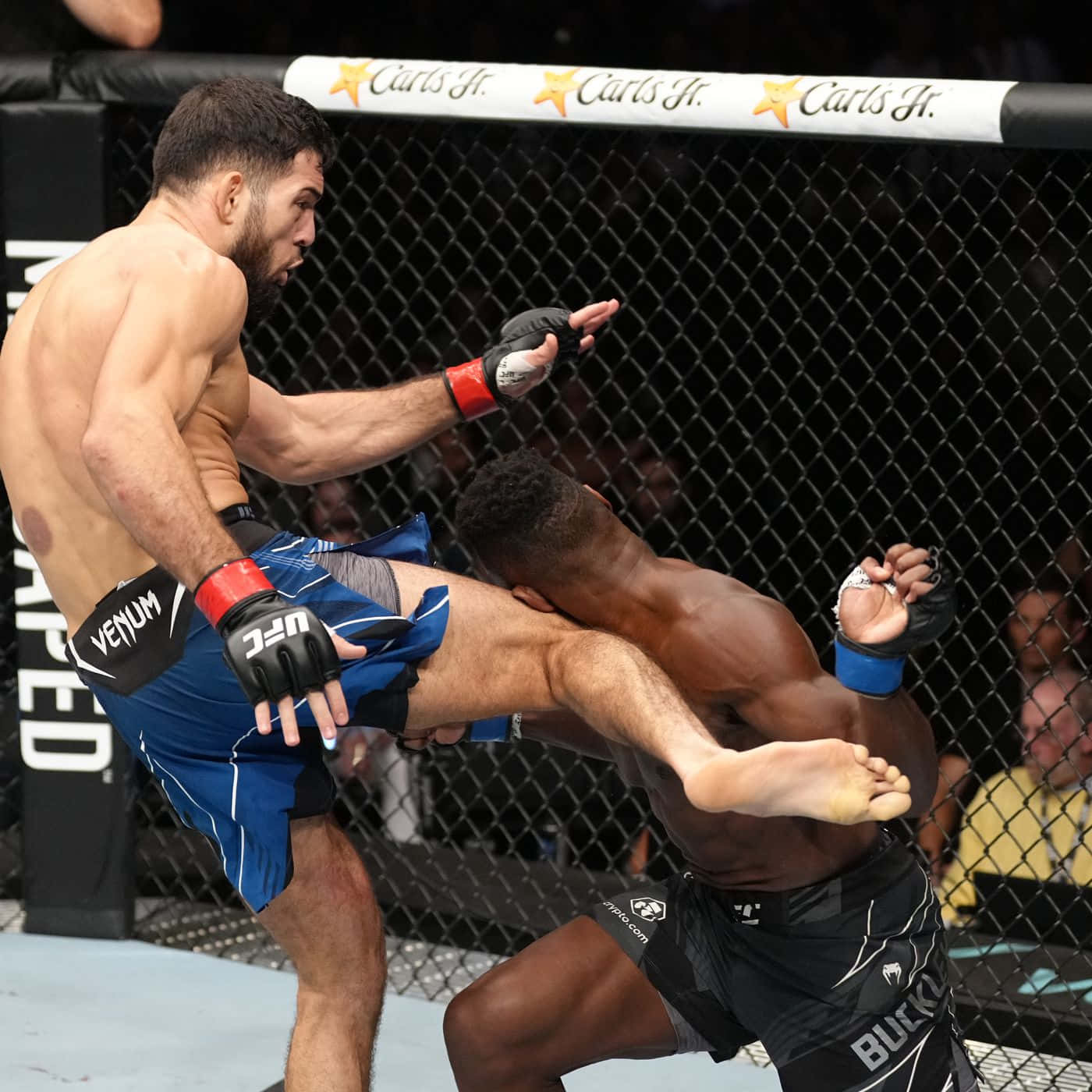 Nassourdine Imavov Kicking Joaquin Buckley Background