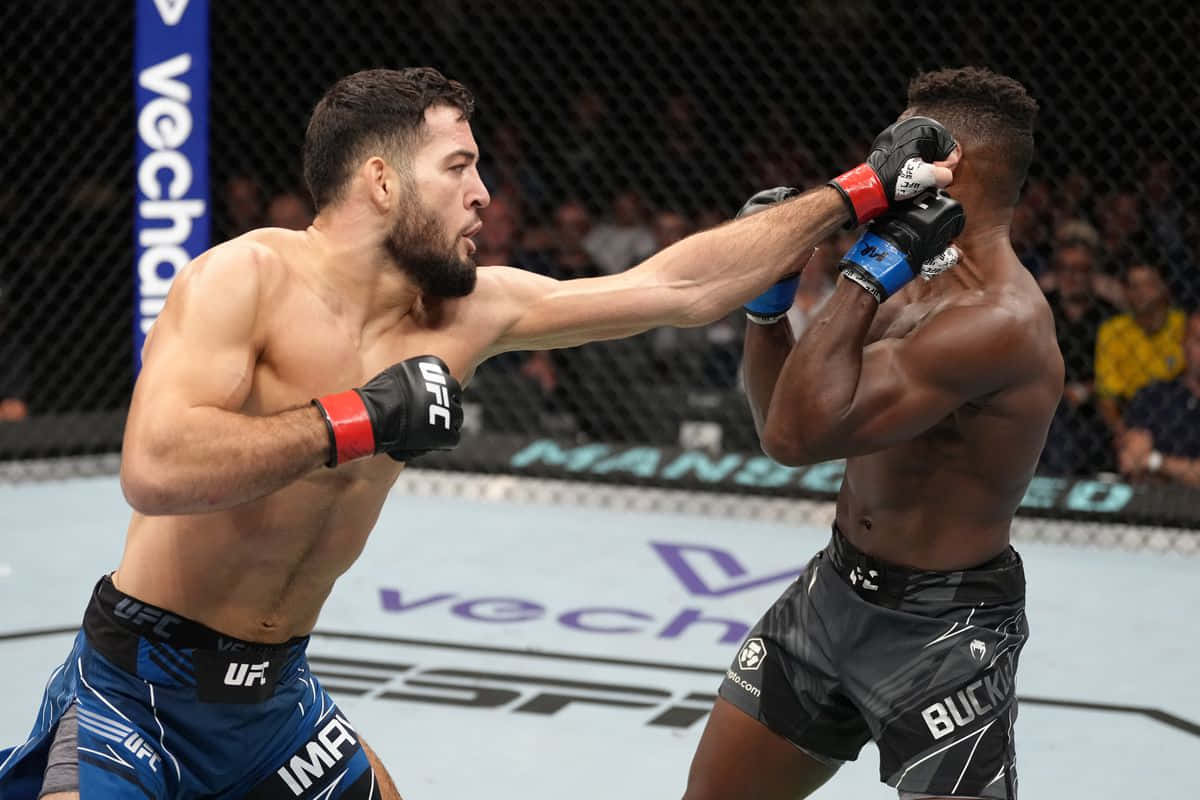 Nassourdine Imavov Punching Joaquin Buckley Background