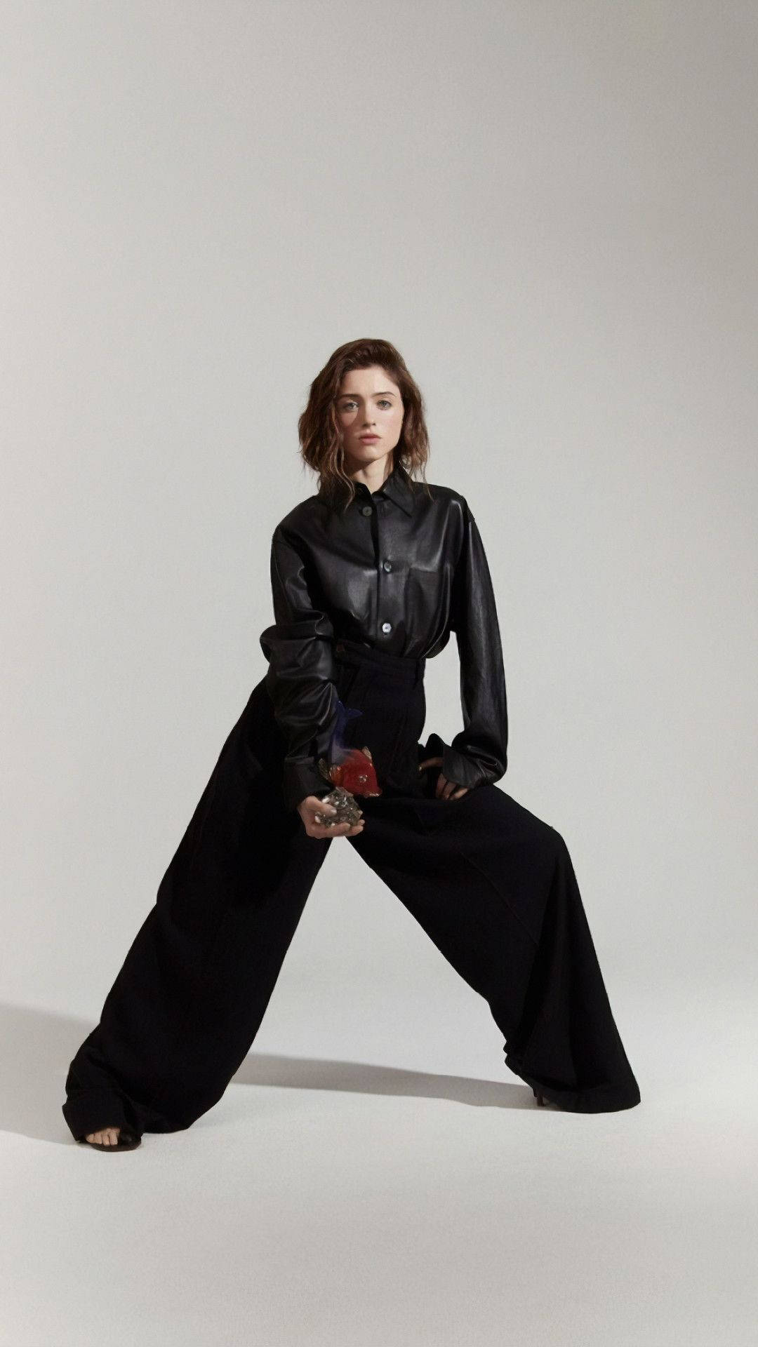 Natalia Dyer In All-black Attire Background