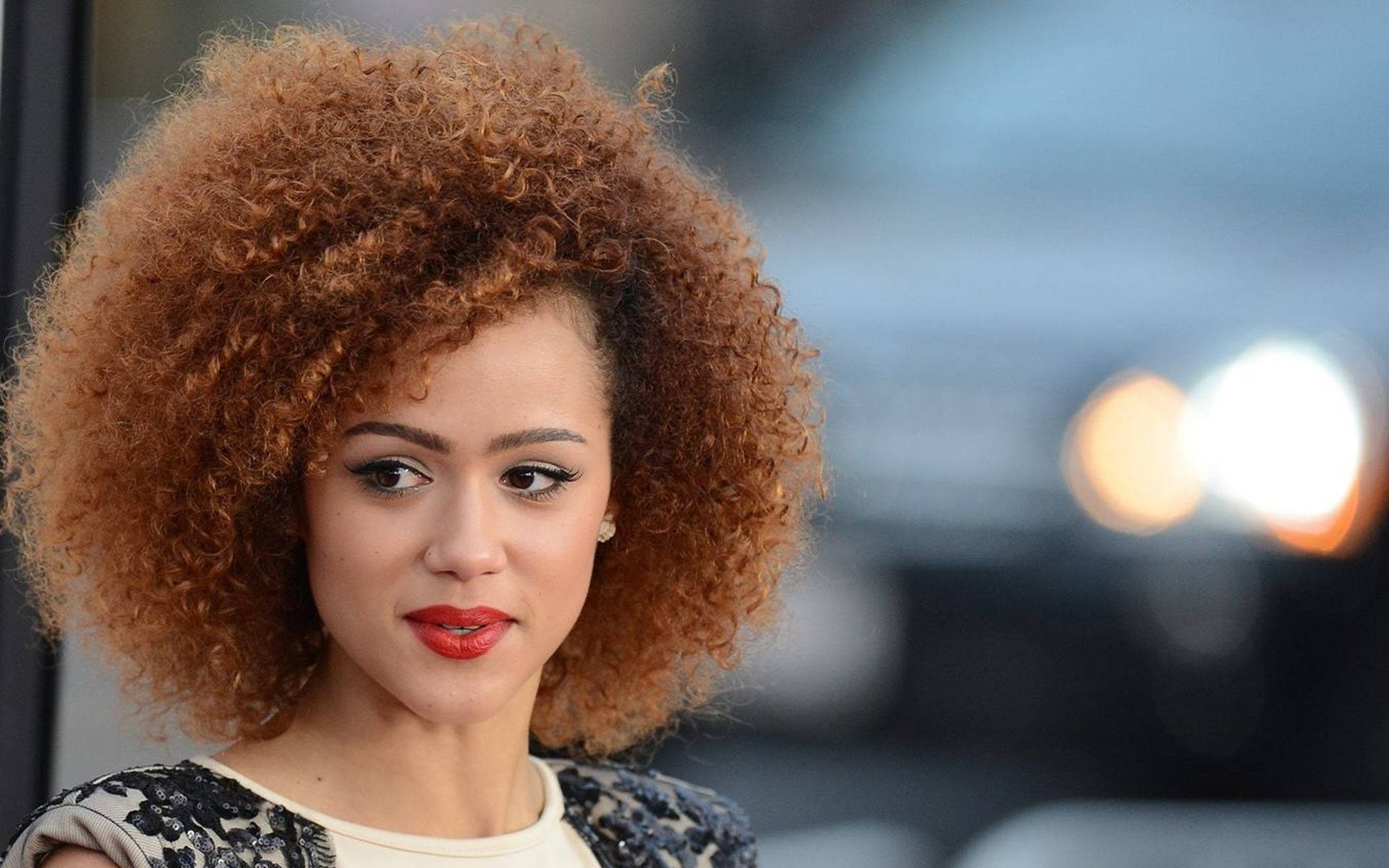 Nathalie Emmanuel Brown Afro Hairstyle Background