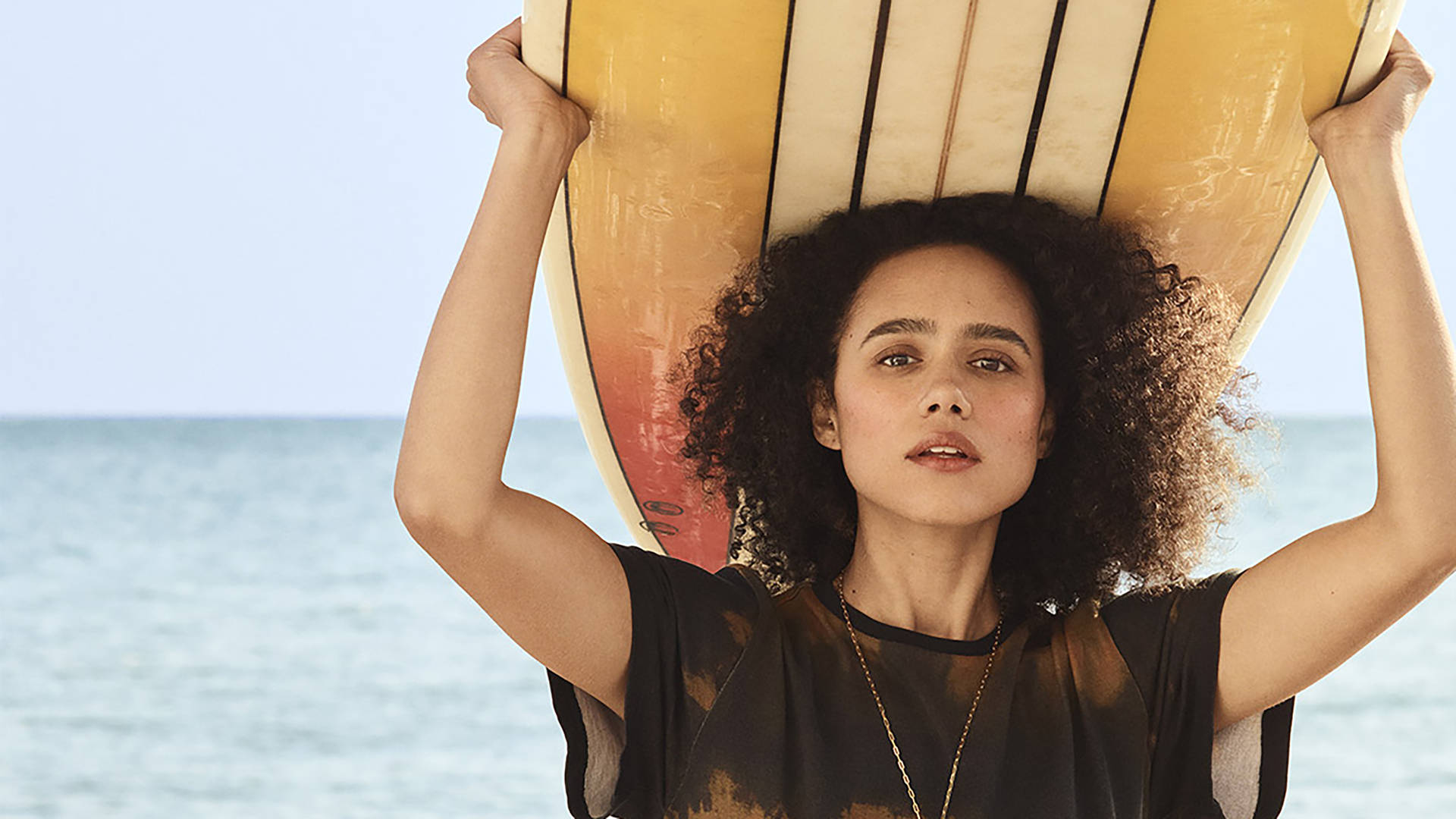 Nathalie Emmanuel With Surfboard