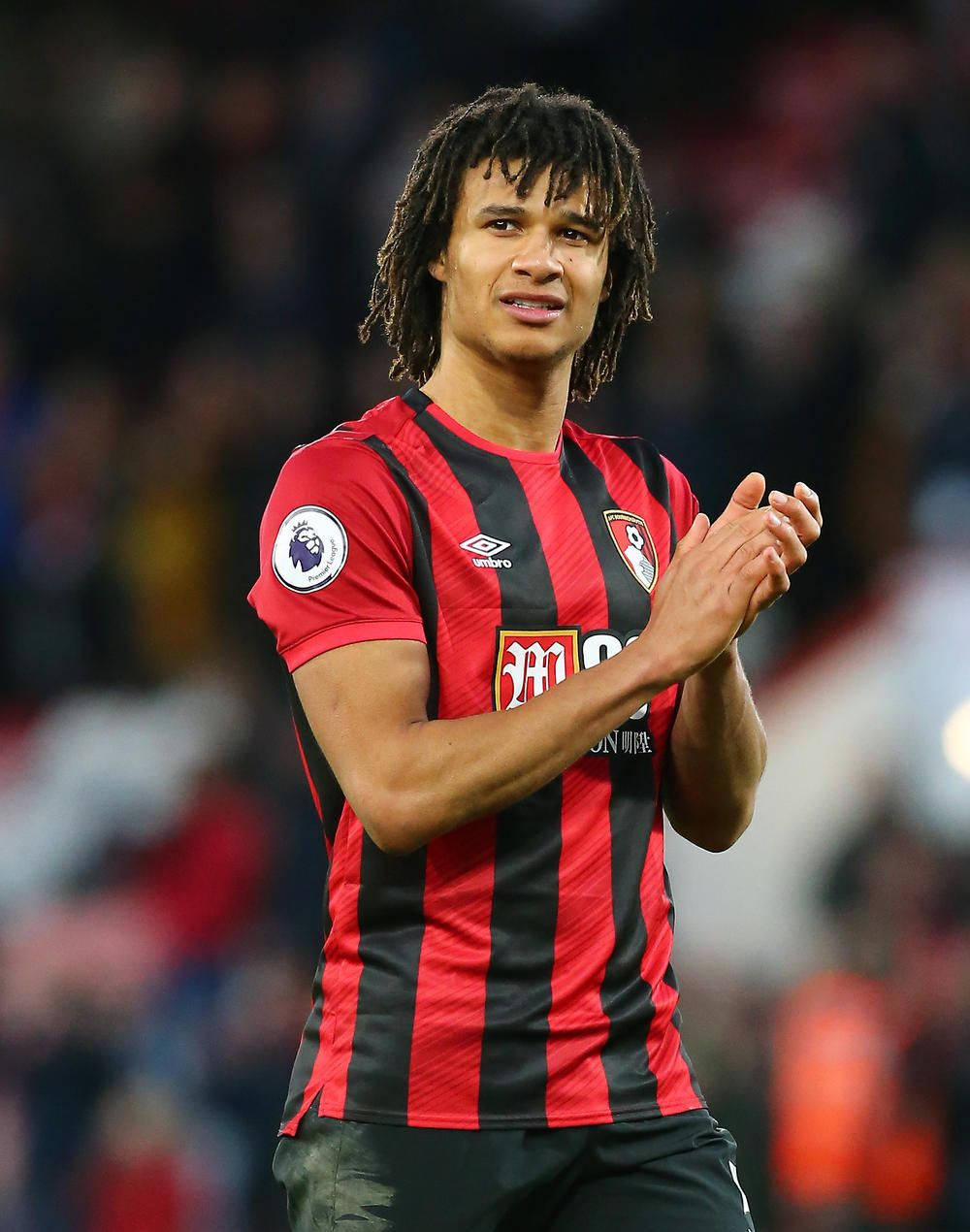 Nathan Ake With His Arms Together Background